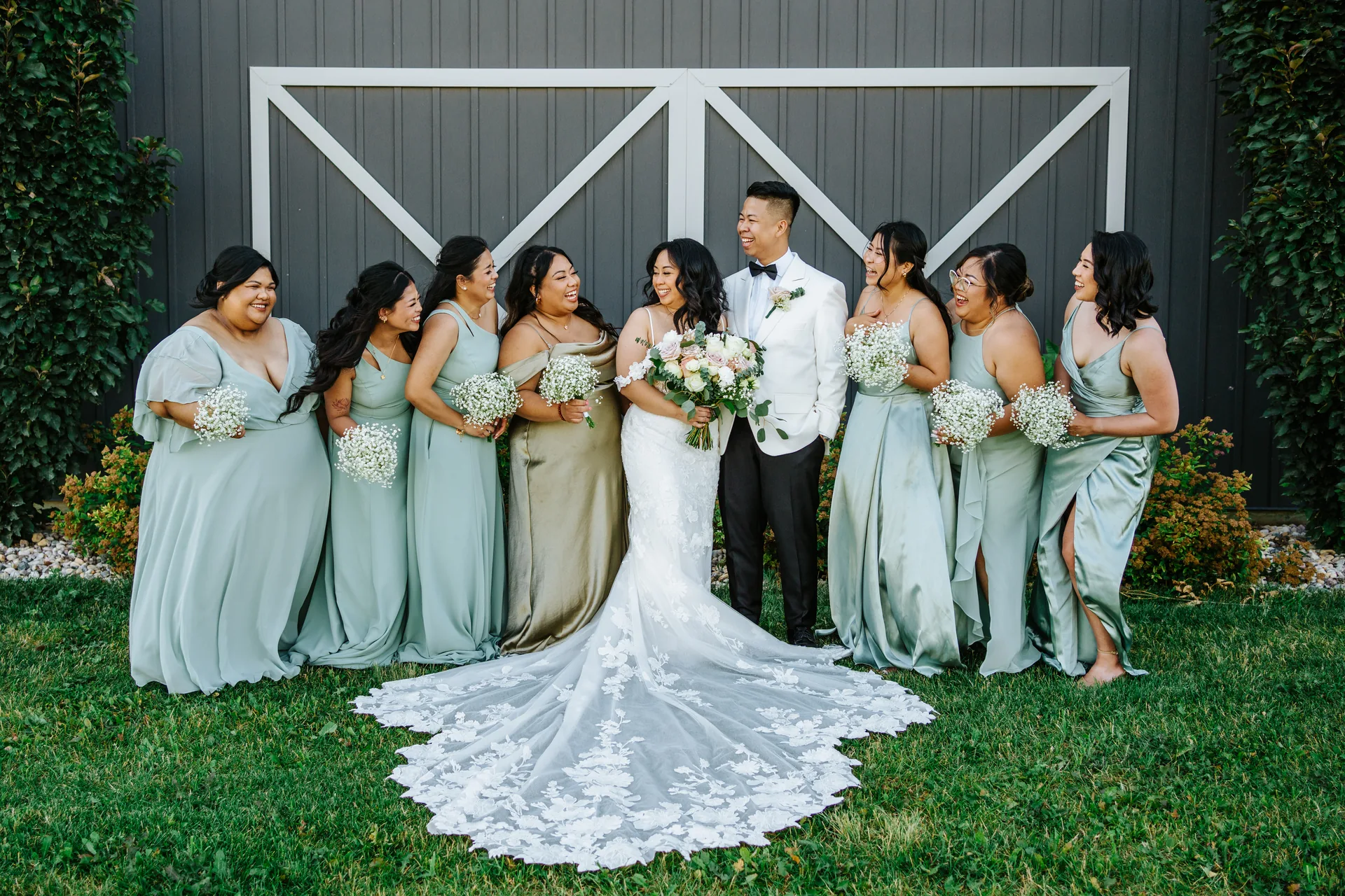 Full wedding party group portrait on the grounds at Hawthorne Estates, Manitoba