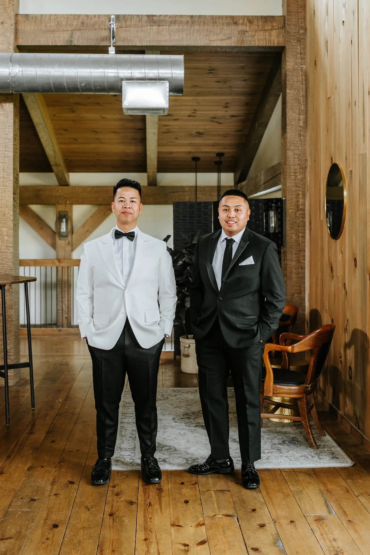 Mark and his best man portrait inside the Hawthorne Estates barn venue, Manitoba