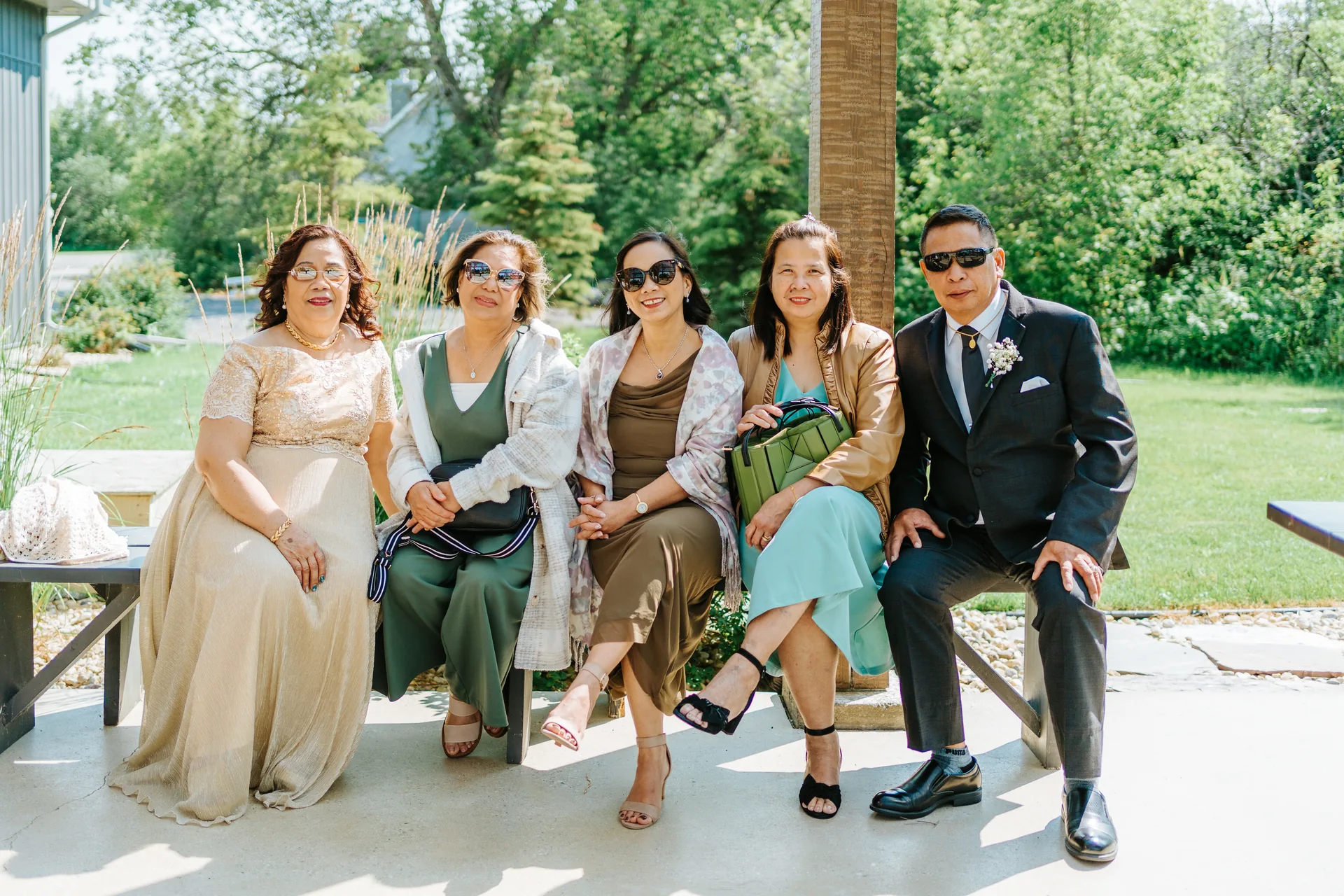 Wedding guests arriving and settling on the ceremony grounds at Hawthorne Estates, Manitoba