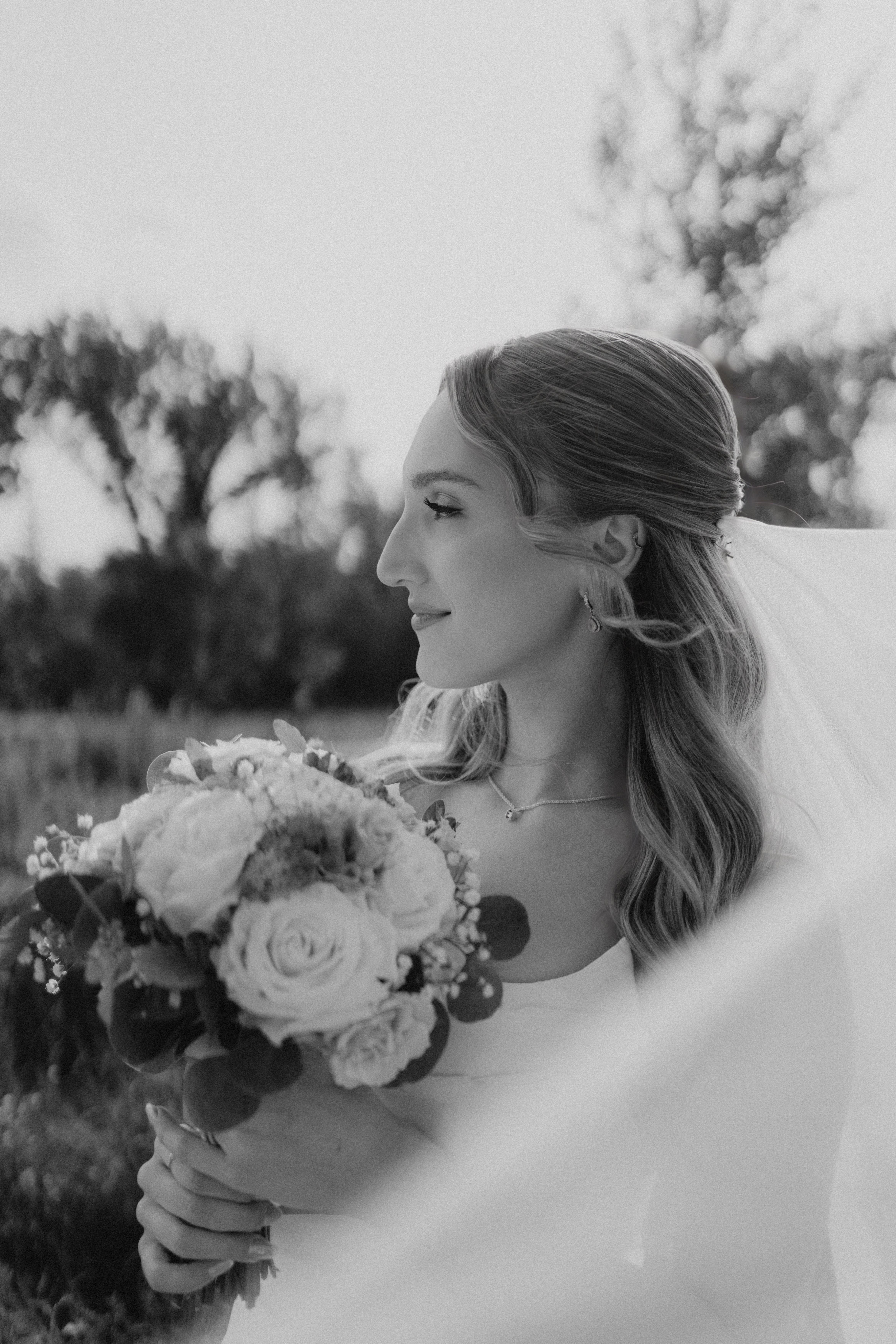 Stunning black and white bridal portrait with veil — intimate wedding photography at Assiniboine Park Winnipeg by Ngo Photography