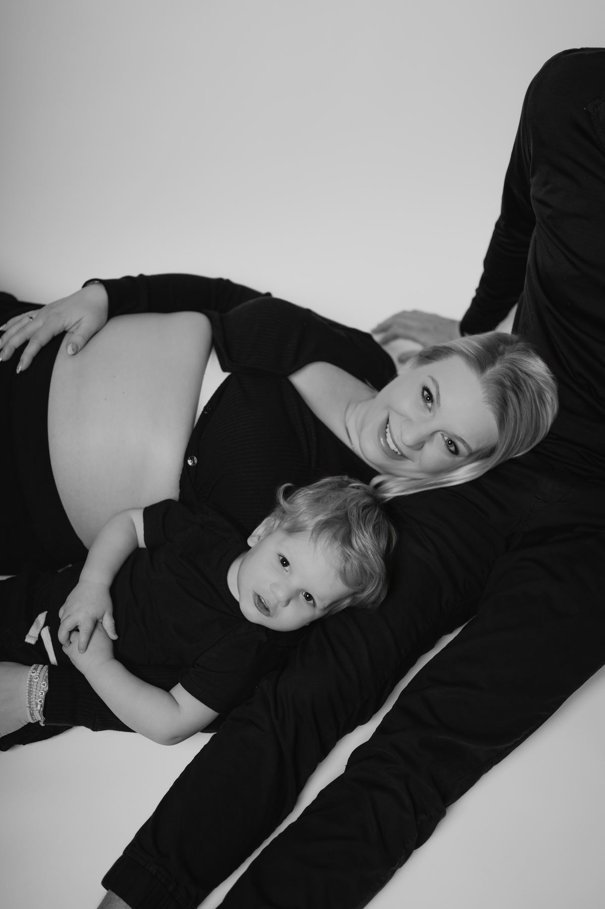 Overhead black and white portrait of mother and toddler — creative maternity family photography Winnipeg by Ngo Photography