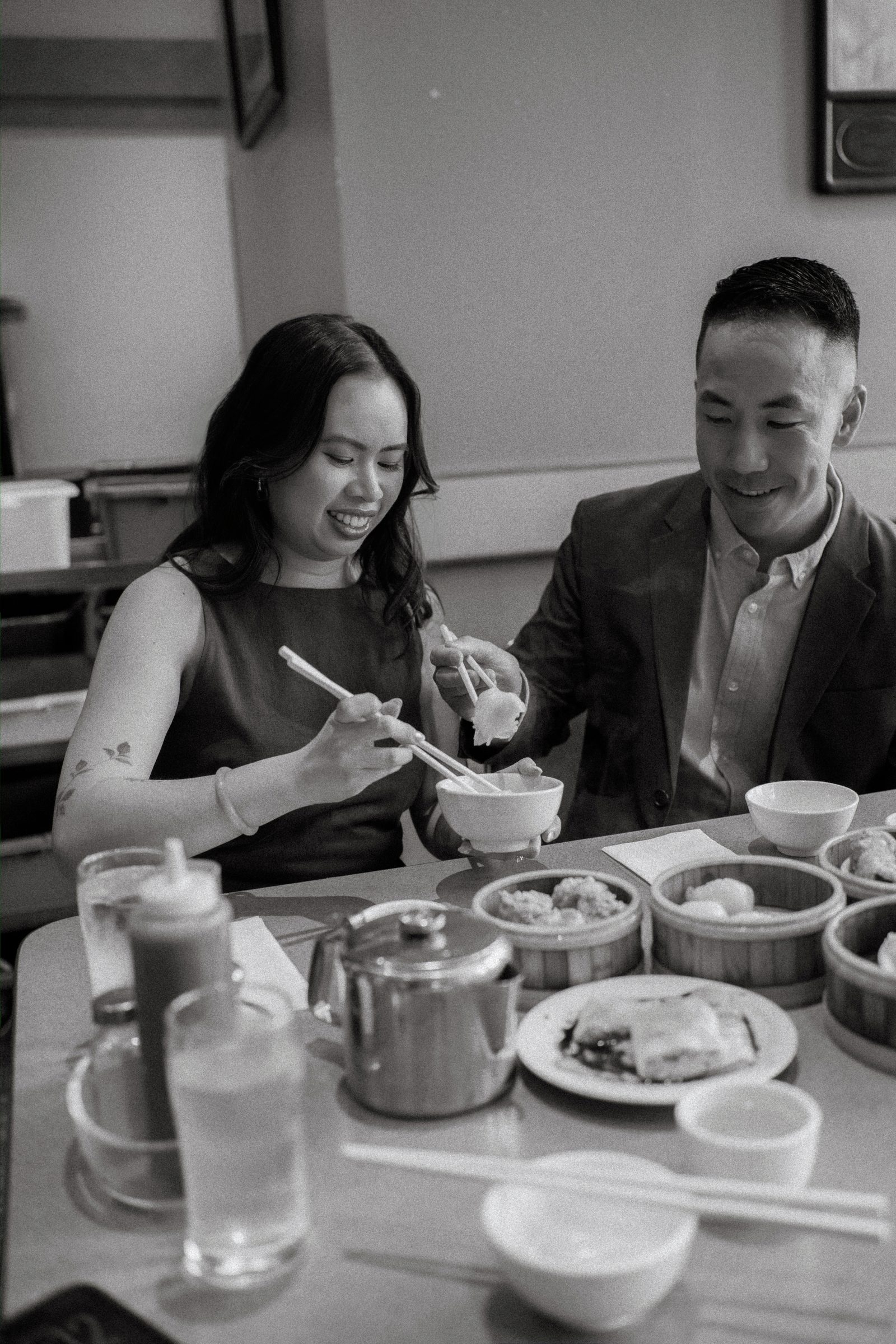 Kum Koon Garden interior with red lanterns and Monica and Jason in the foreground — Winnipeg Chinese restaurant engagement photography by Chris Ngo