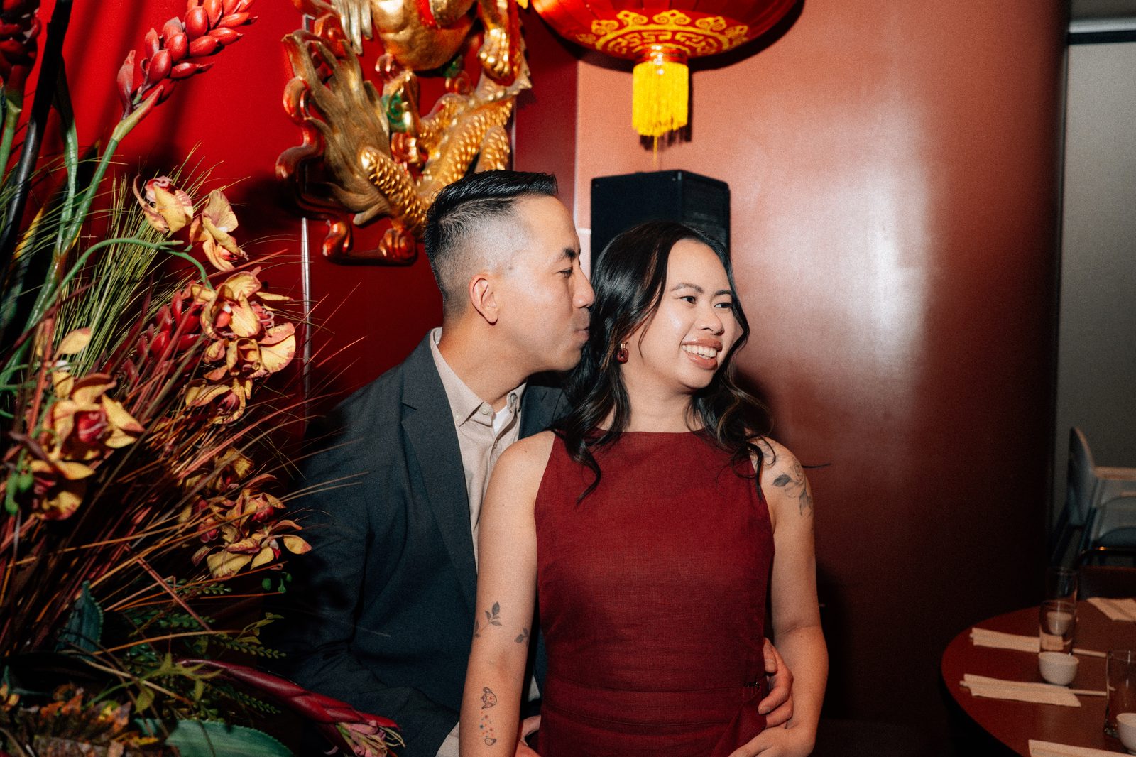 Monica and Jason close portrait with Kum Koon Garden red lanterns in background — Chinese Vietnamese engagement photography by Chris Ngo