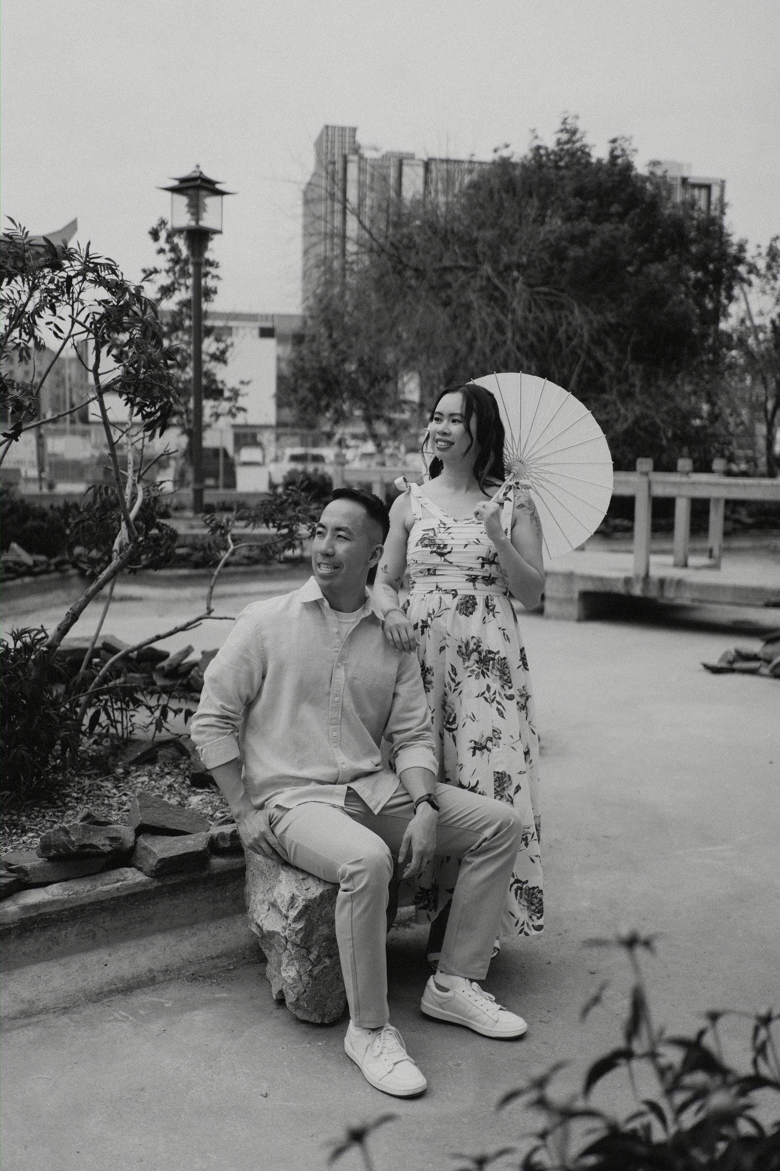 Monica and Jason candid moment in Winnipeg Chinatown — Chinese Vietnamese heritage engagement photography by Chris Ngo
