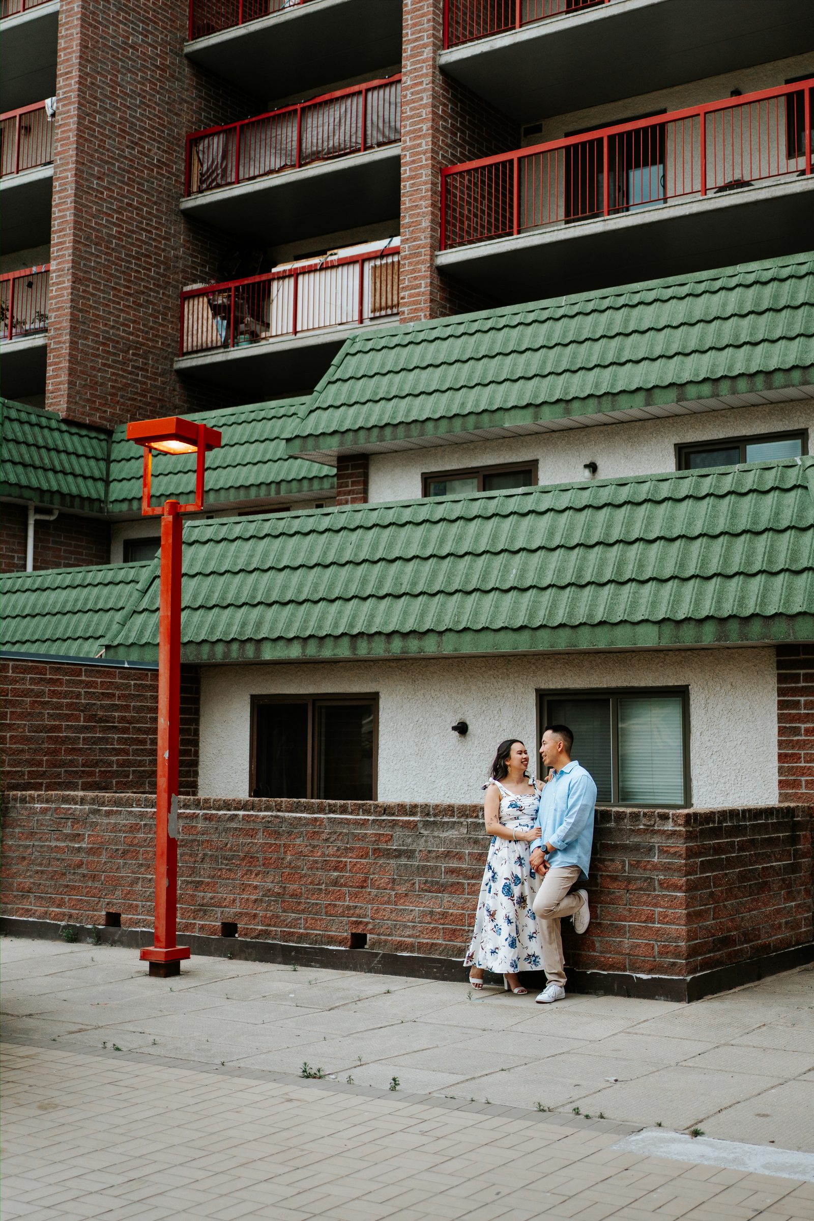 Monica and Jason intimate portrait near Winnipeg Chinatown landmarks — engagement photography by Ngo Photography