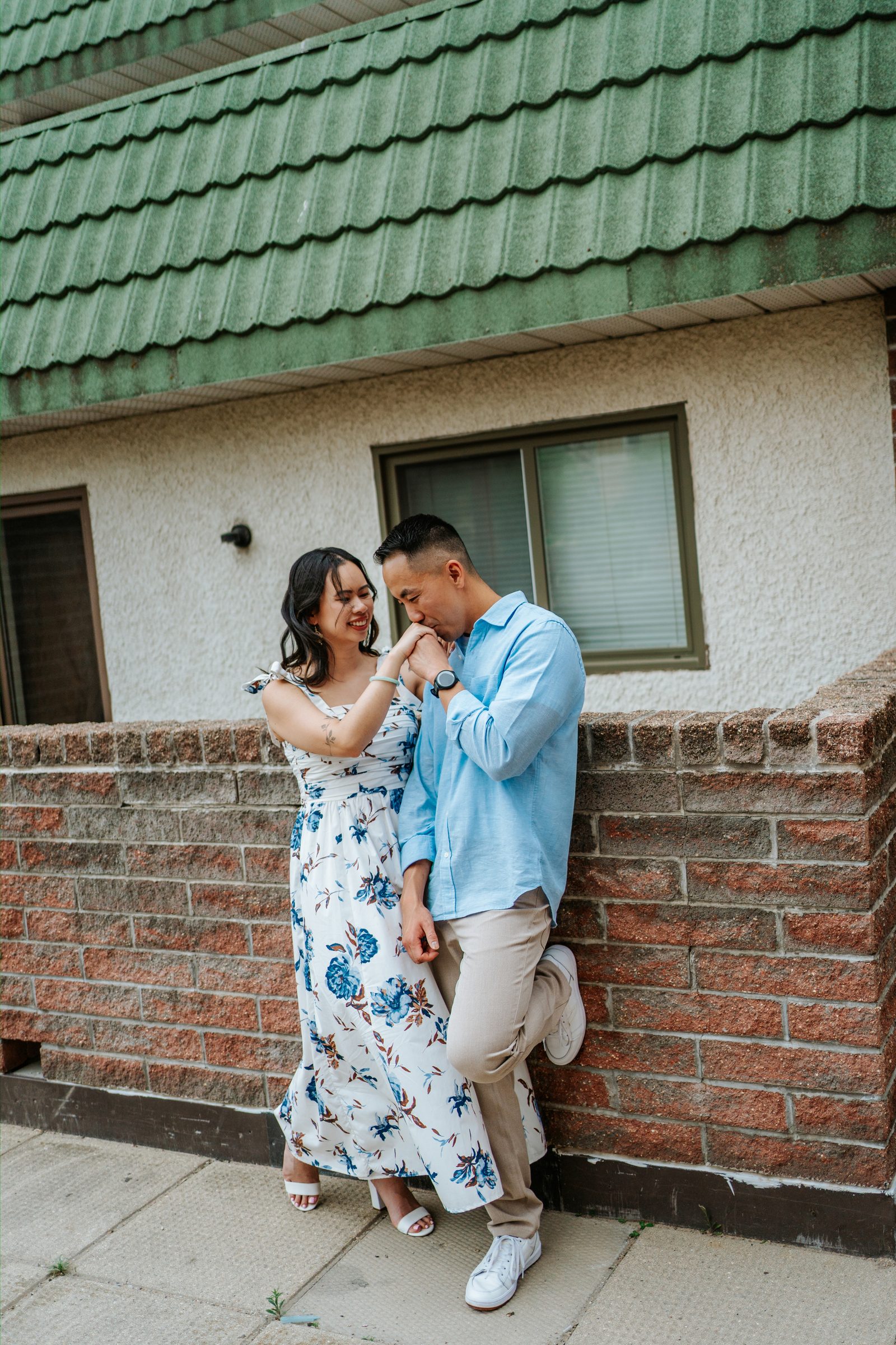 Jason and Monica in a quiet alley in Winnipeg Chinatown — Chinese Vietnamese heritage engagement session by Ngo Photography