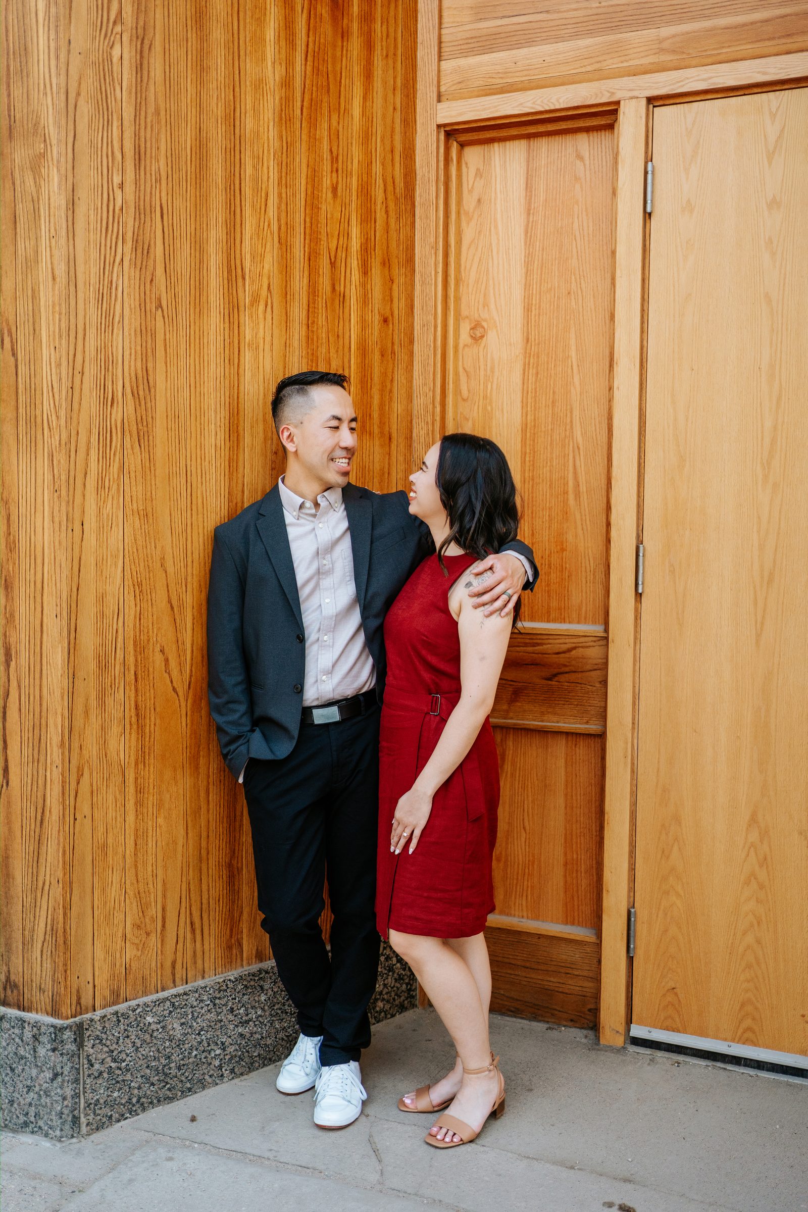 Monica and Jason in the studio with warm interior light — Winnipeg engagement photography by Chris Ngo