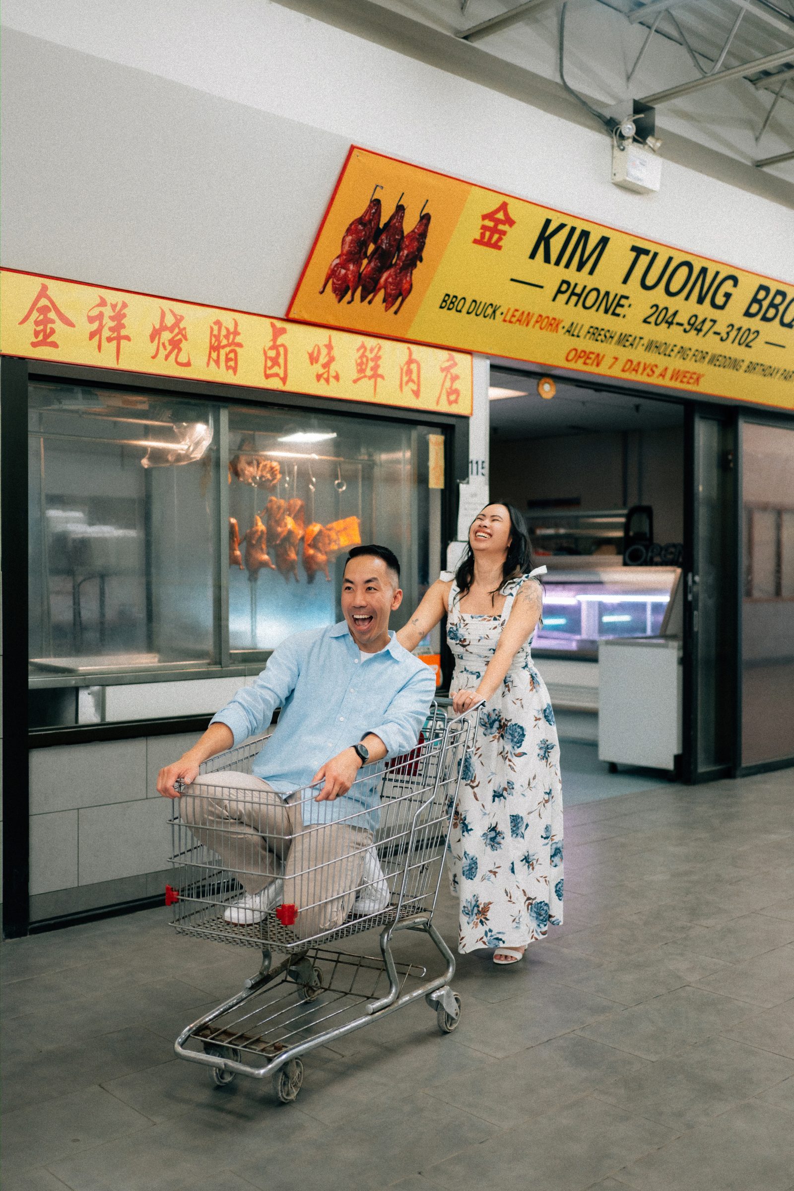 Close portrait of Monica and Jason inside Sun-Wah Centre Chinatown Winnipeg — engagement photography by Chris Ngo