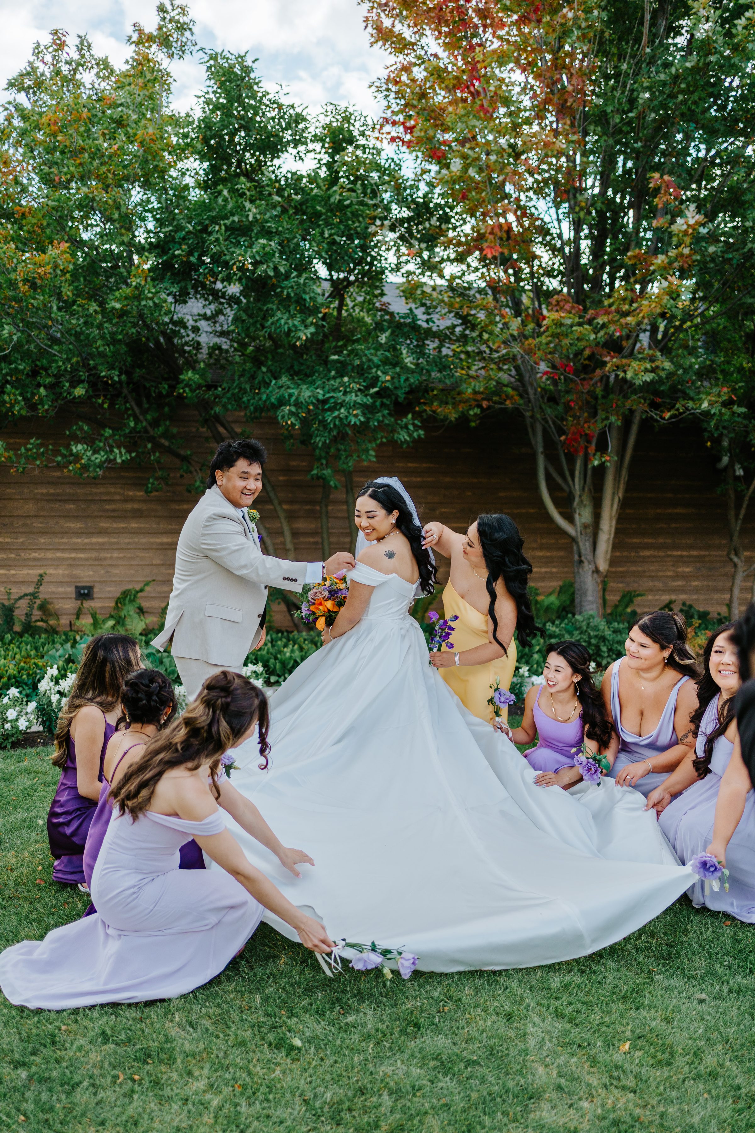Paul and Ayanna bridal party on lawn — Manitoba wedding photographer