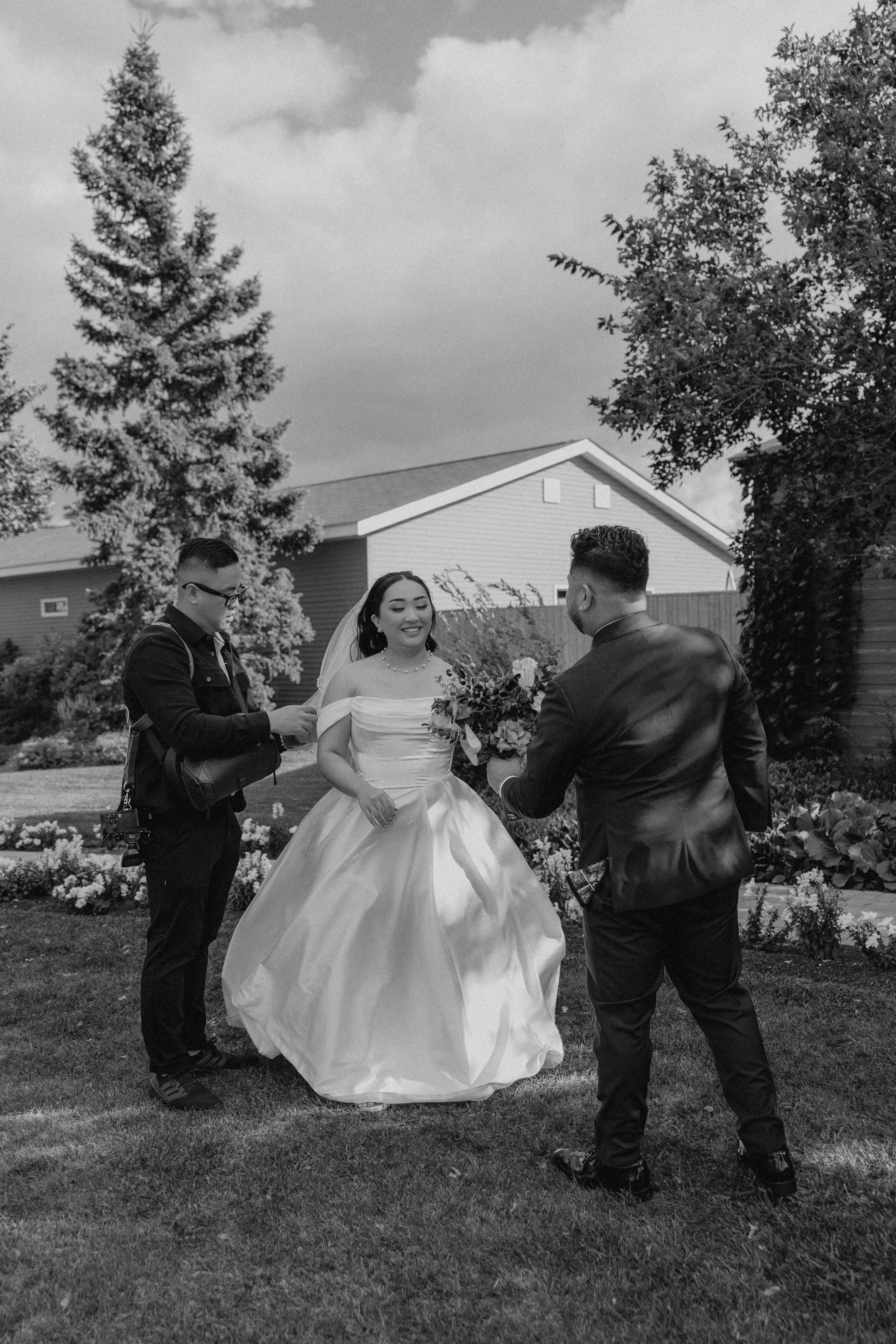 Paul and Ayanna share a quiet close moment together in the Breezy Bend gardens — black and white couple portrait by Ngo Photography Winnipeg