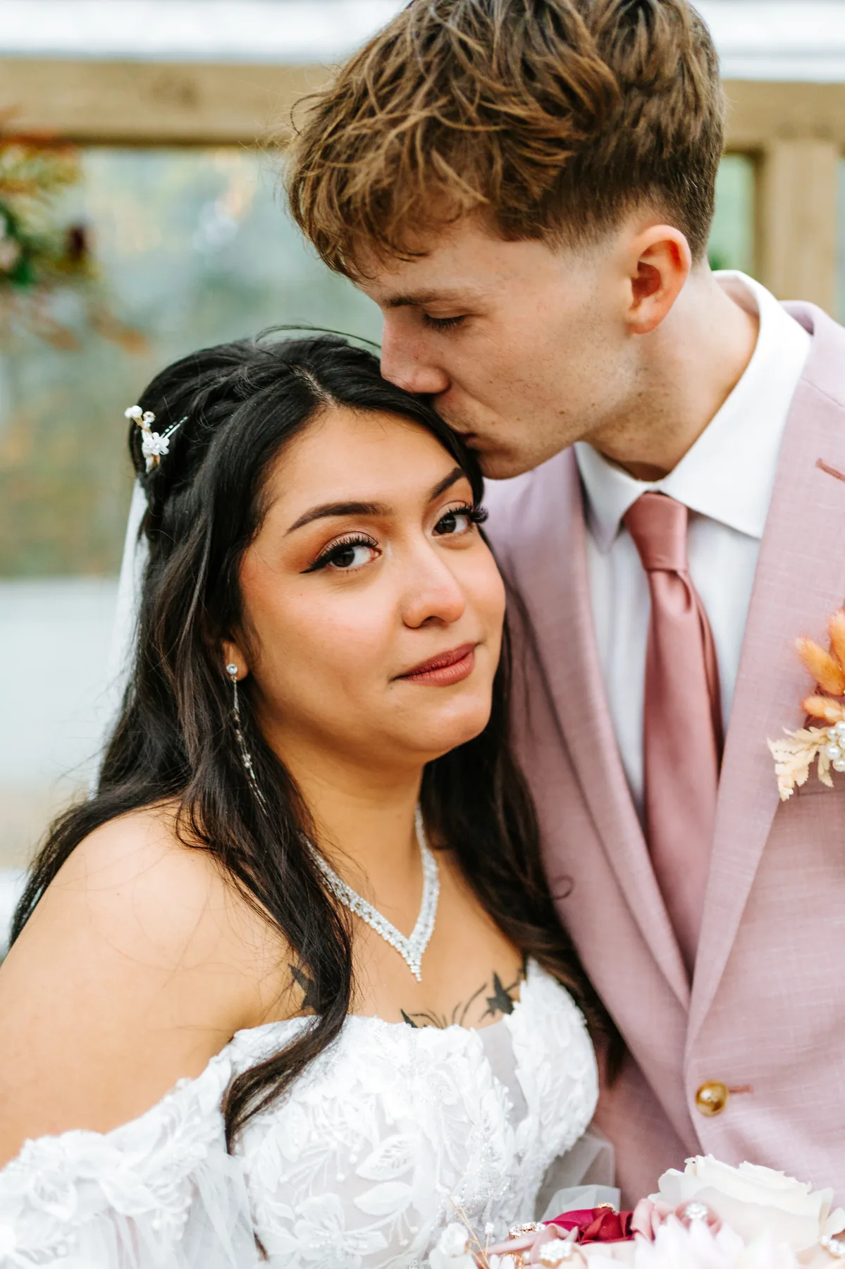 Intimate close portrait of Paola and Riley at the reception at Oakland Estates Manitoba wedding — Chris Ngo
