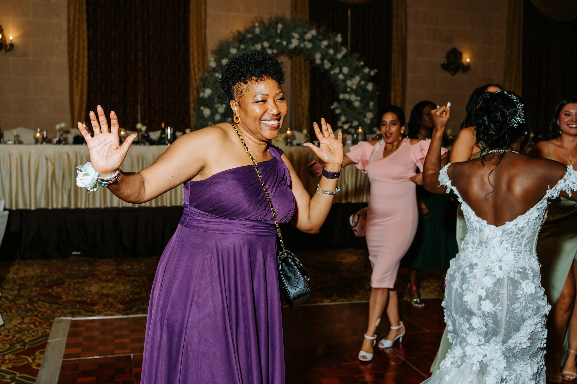 Bride with guests on the dance floor at the Fort Garry Hotel Provencher Ballroom, Winnipeg