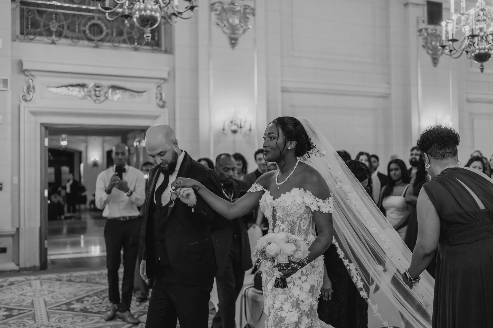 Bride escorted down the aisle during the processional at the Fort Garry Hotel, Winnipeg