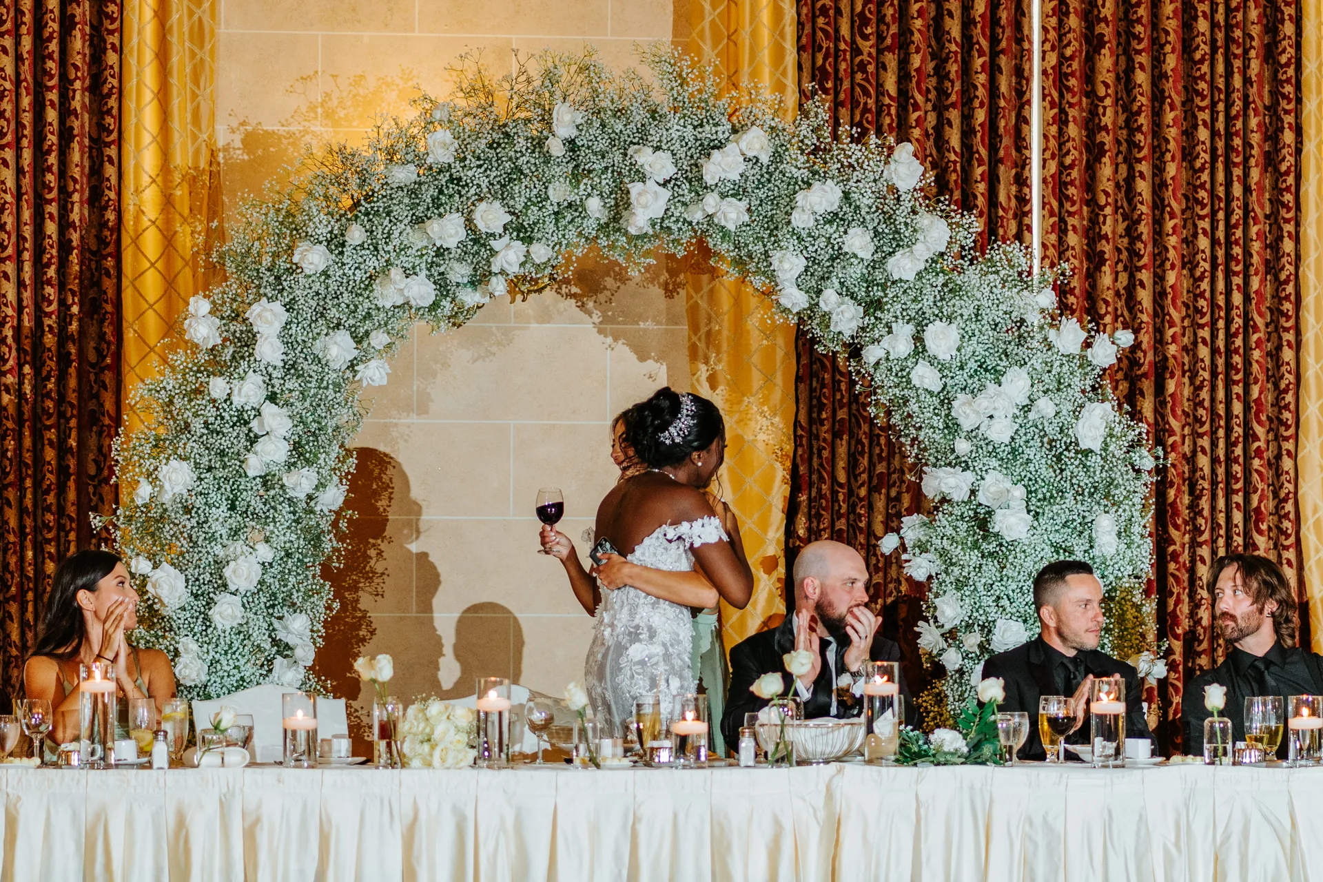 Bride giving a speech at the head table in the Fort Garry Hotel Provencher Ballroom, Winnipeg