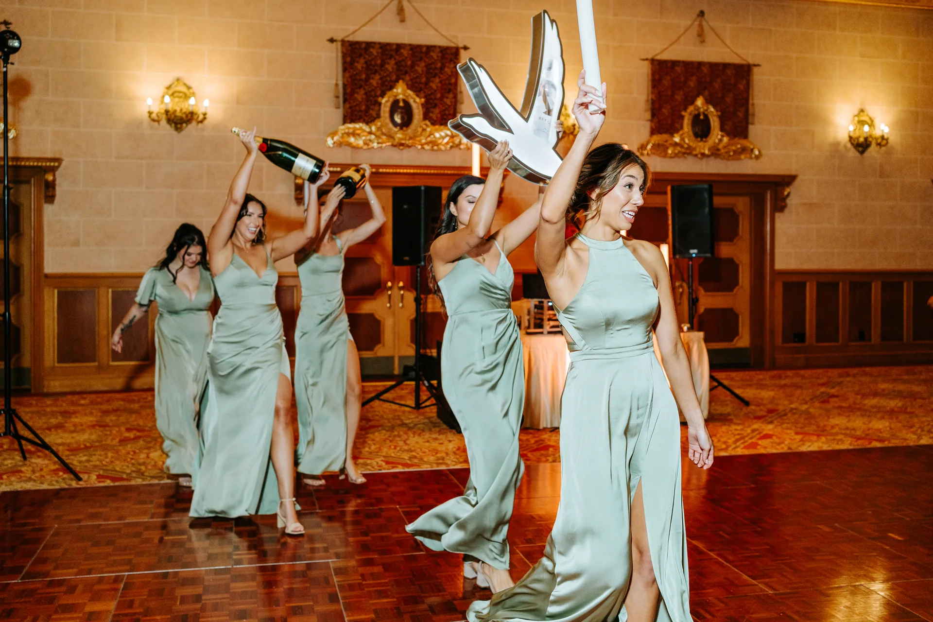 Bridesmaids entrance with champagne glasses at the Fort Garry Hotel reception, Winnipeg