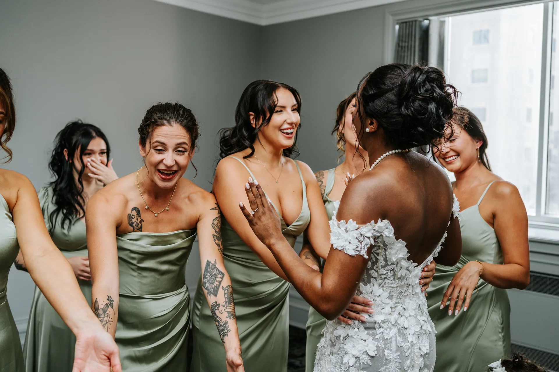 Bridesmaids reacting to seeing Stephanie in her wedding dress for the first time at the Fort Garry Hotel, Winnipeg