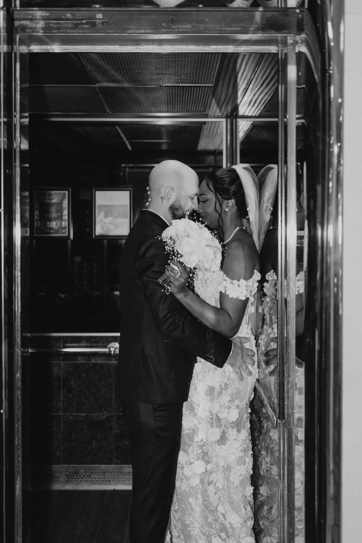 Stephanie and Brock intimate couple portrait in the vintage elevator at the Fort Garry Hotel, Winnipeg