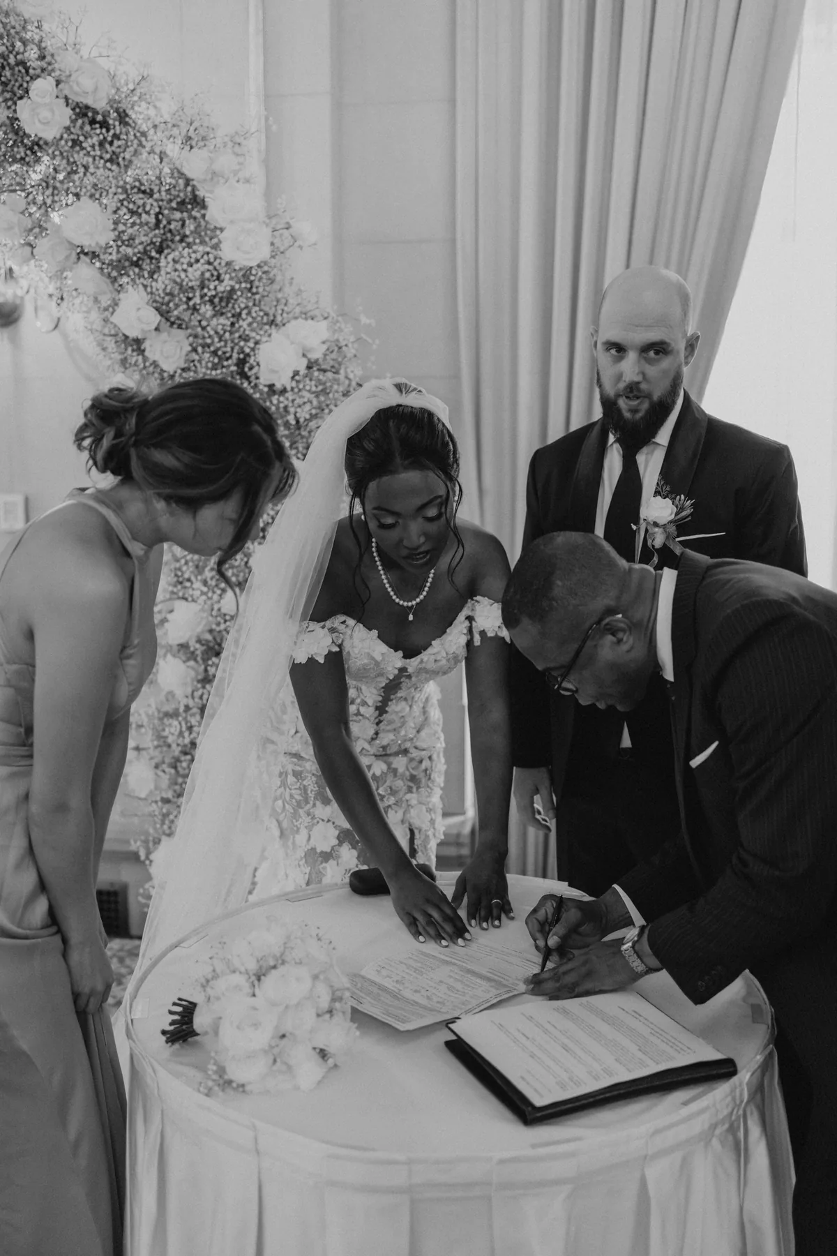 Signing the marriage register during the Fort Garry Hotel wedding ceremony, Winnipeg
