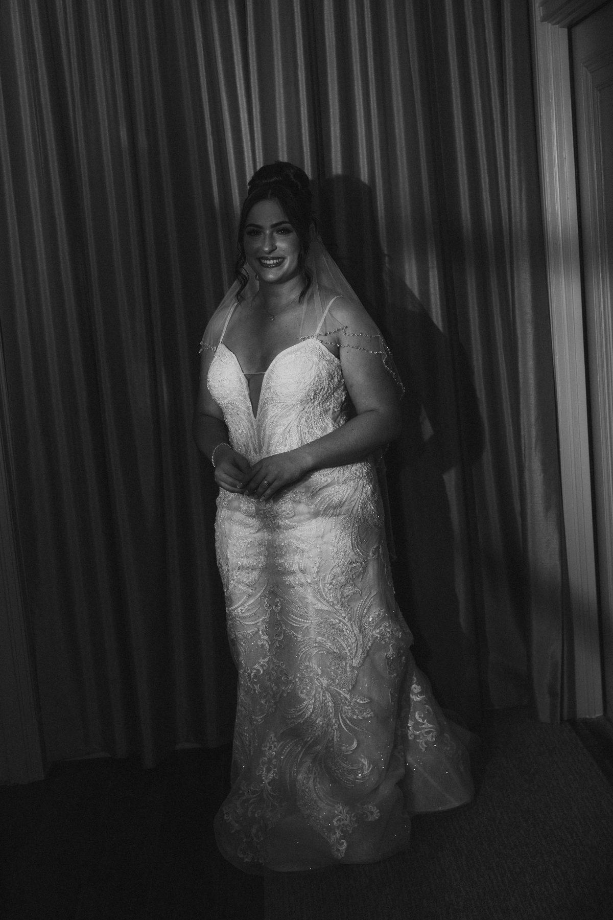 Bride in her wedding gown getting ready in the historic suite at The Fort Garry Hotel Winnipeg — Ngo Photography