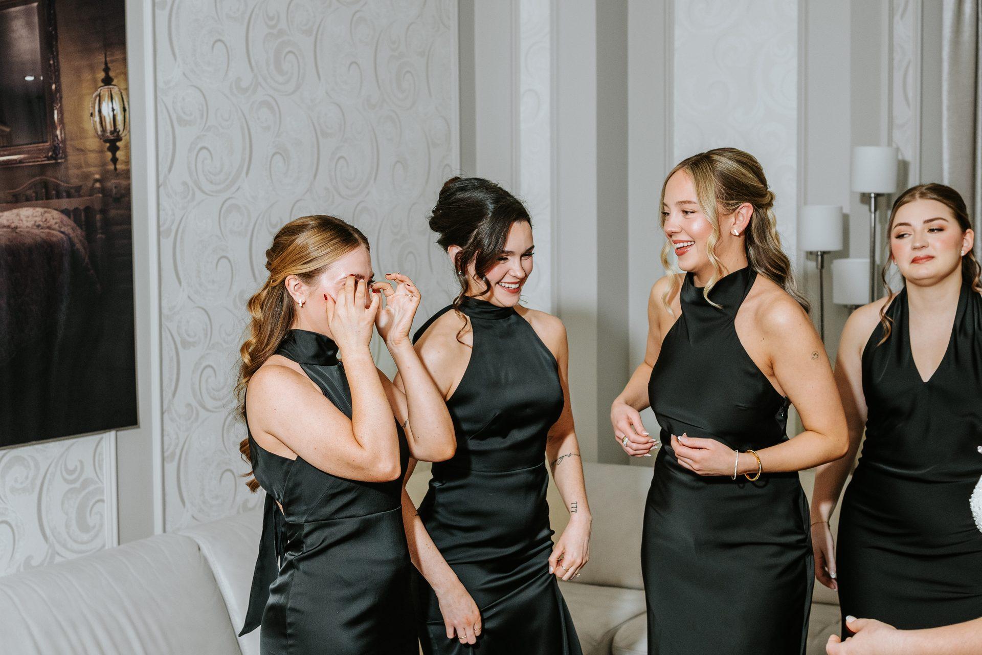 Bridesmaids with emotional tears during first look at the Fort Garry Hotel, Winnipeg