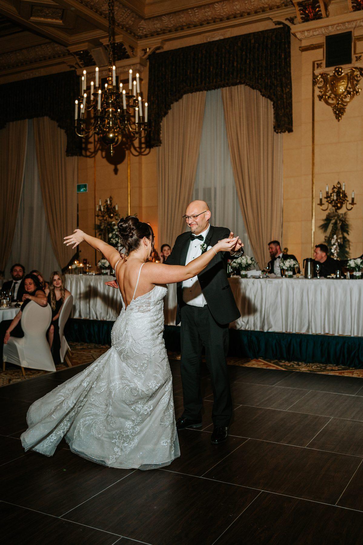 Father daughter dance in the Provencher Ballroom at The Fort Garry Hotel Winnipeg — emotional wedding photography by Ngo Photography