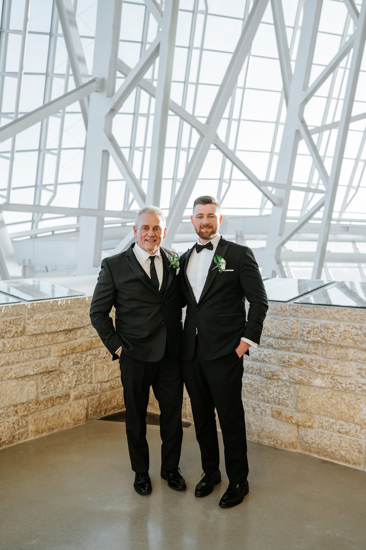Groom and father on the alabaster wall at the Canadian Museum for Human Rights Winnipeg — Ngo Photography