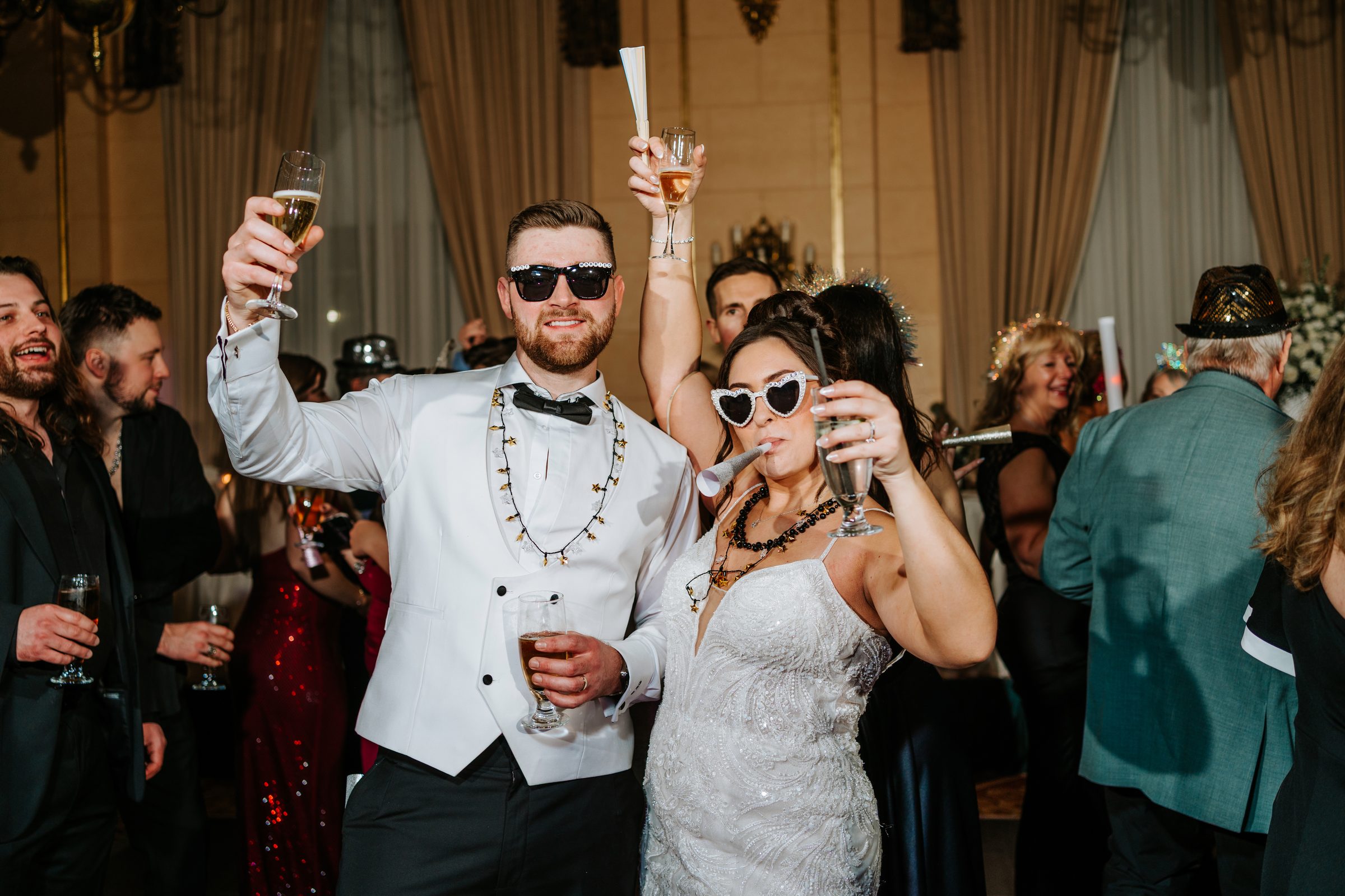Stef and Brett celebrating New Year's Eve midnight at their Winnipeg wedding reception — NYE wedding photography by Ngo Photography