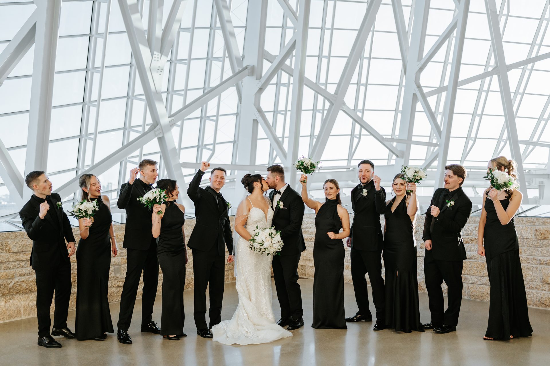Wedding party celebrating at the Canadian Museum for Human Rights Winnipeg — photographed by award-winning Winnipeg wedding photographer Chris Ngo