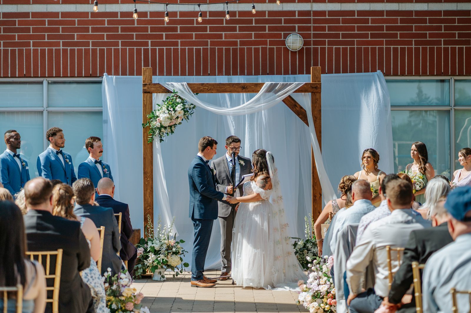 Stephanie and Drew's wedding ceremony at the Caboto Centre outdoor Piazza in Winnipeg — photography by Chris Ngo, Ngo Photography