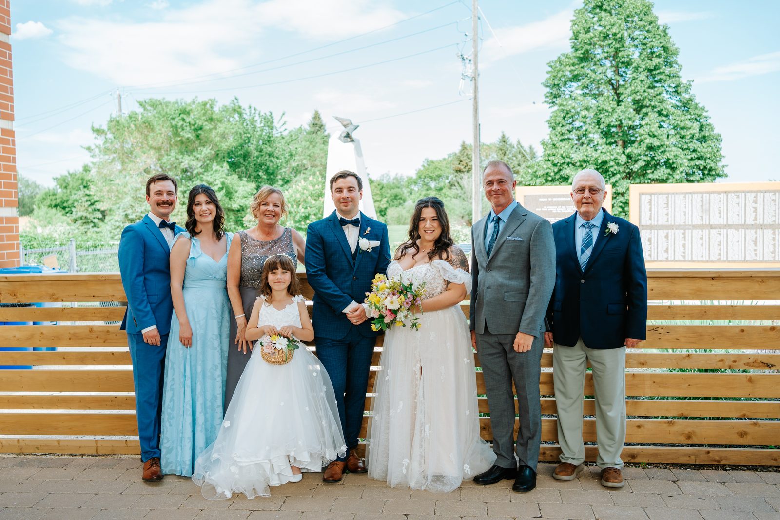Guests celebrating after Stephanie and Drew's Caboto Centre ceremony — Winnipeg wedding photography by Ngo Photography
