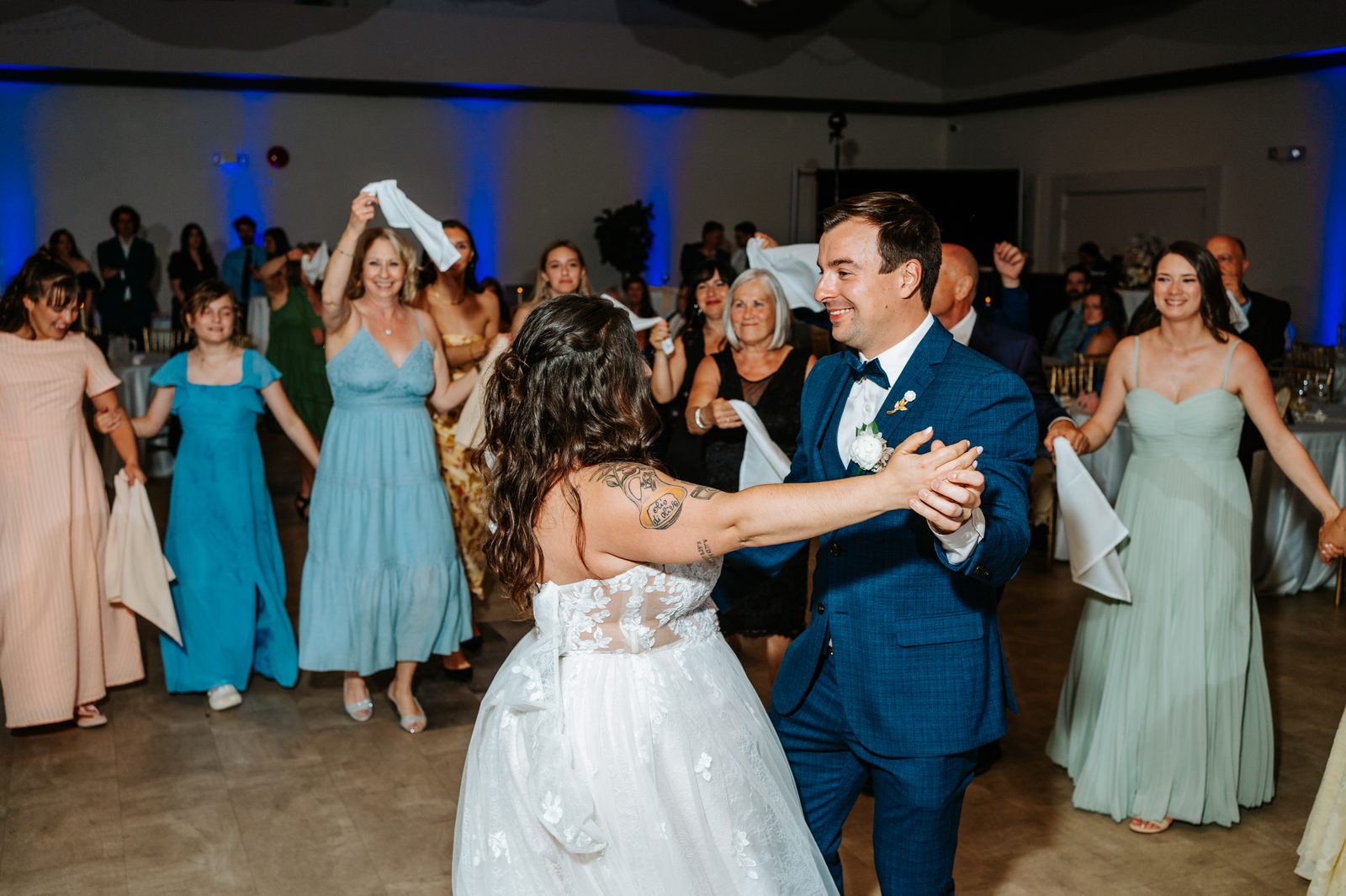 Full dance floor at the Caboto Centre Mauro Hall — Stephanie and Drew's June 2026 Winnipeg wedding, by Chris Ngo