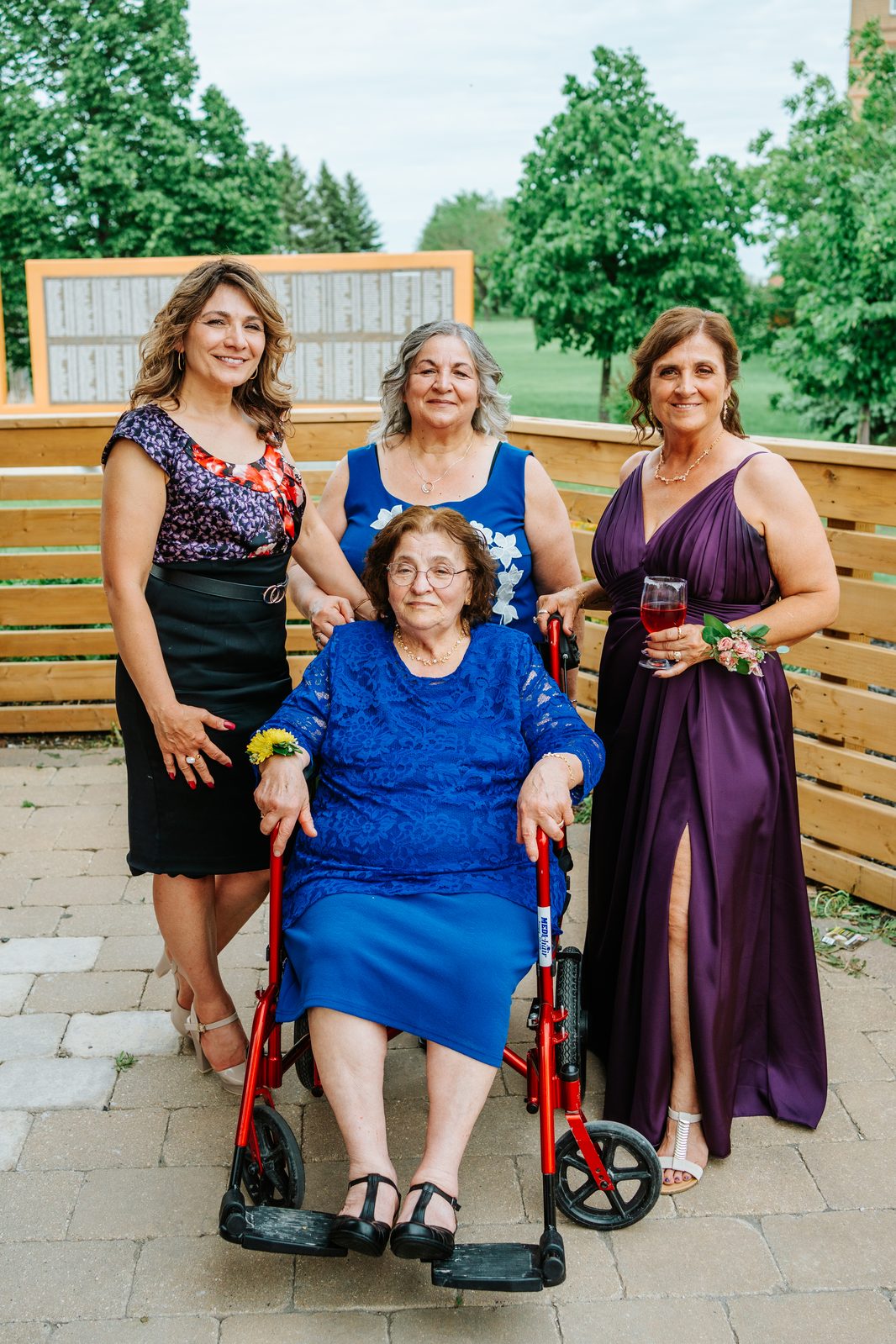 Wide family portrait at the Caboto Centre patio — Stephanie and Drew's Winnipeg wedding by Chris Ngo