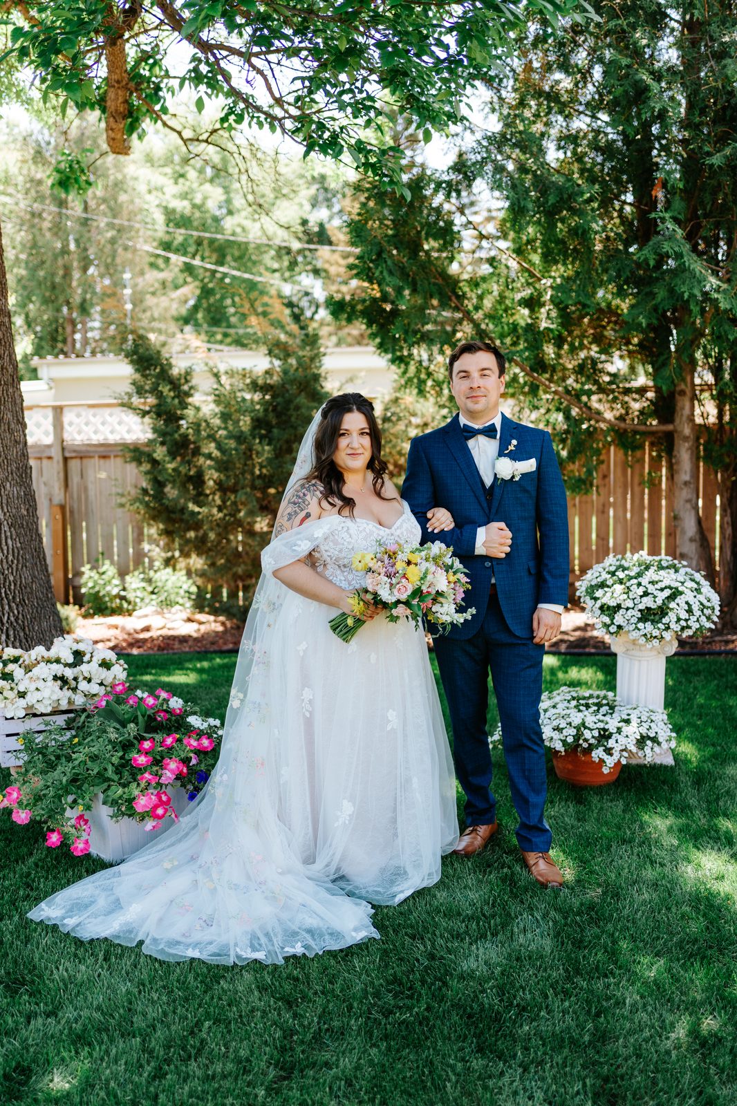 Private vow exchange in the backyard before the Caboto Centre ceremony — wedding photography by Chris Ngo Winnipeg