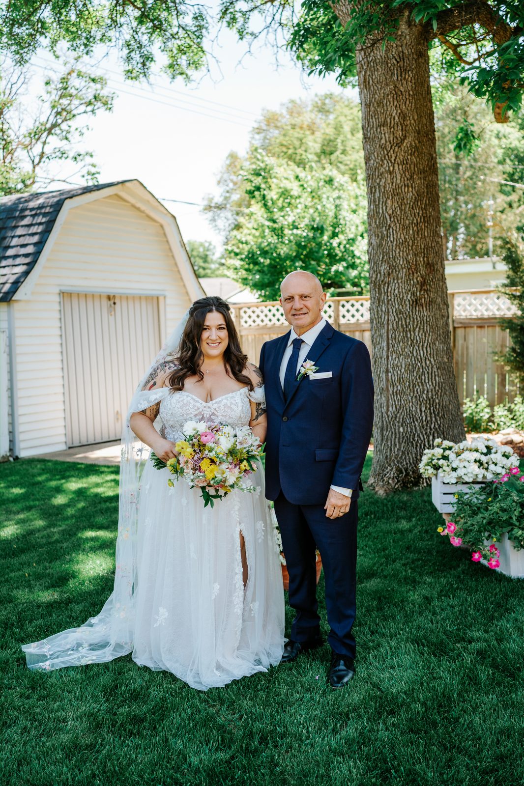 Stephanie and Drew embracing after private vows — Caboto Centre Winnipeg wedding photography by Ngo Photography