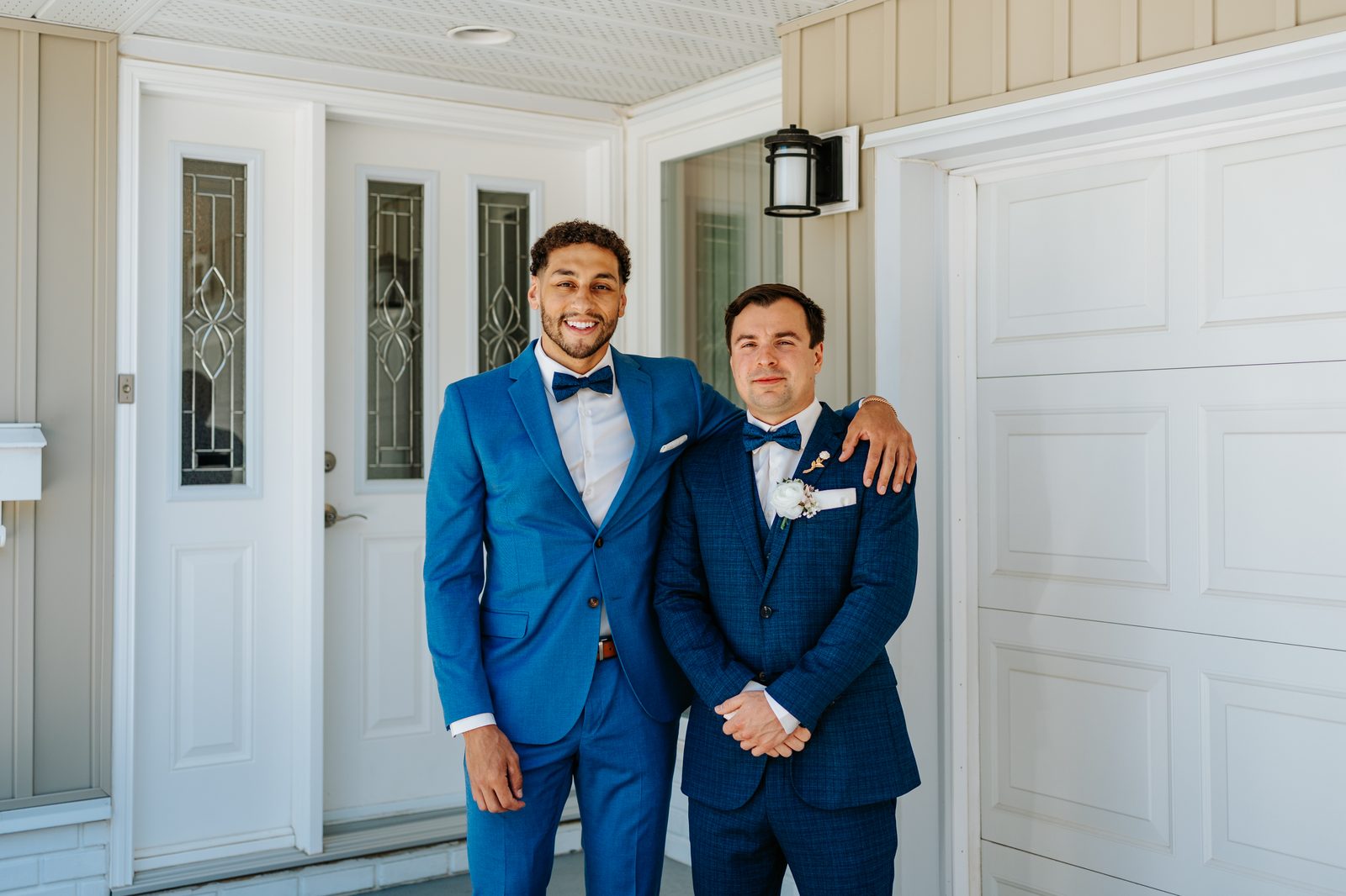 Drew getting ready in navy three-piece suit — Caboto Centre Winnipeg wedding photography by Chris Ngo, Ngo Photography