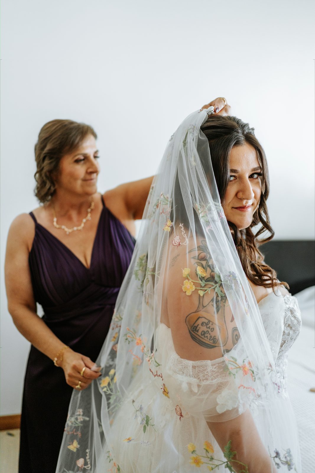 Stephanie's mother placing the floral embroidered veil — the quiet centre of the morning, Caboto Centre wedding by Chris Ngo