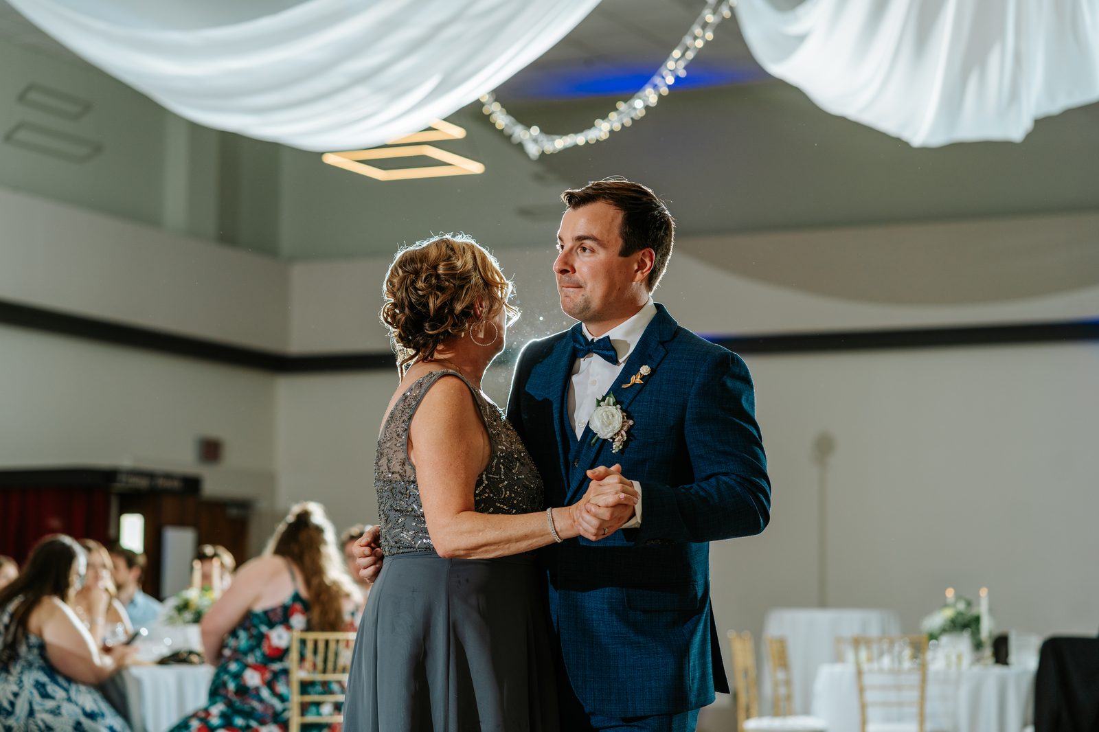 Candid reception moment in the Caboto Centre Mauro Hall — Stephanie and Drew's Winnipeg wedding by Ngo Photography
