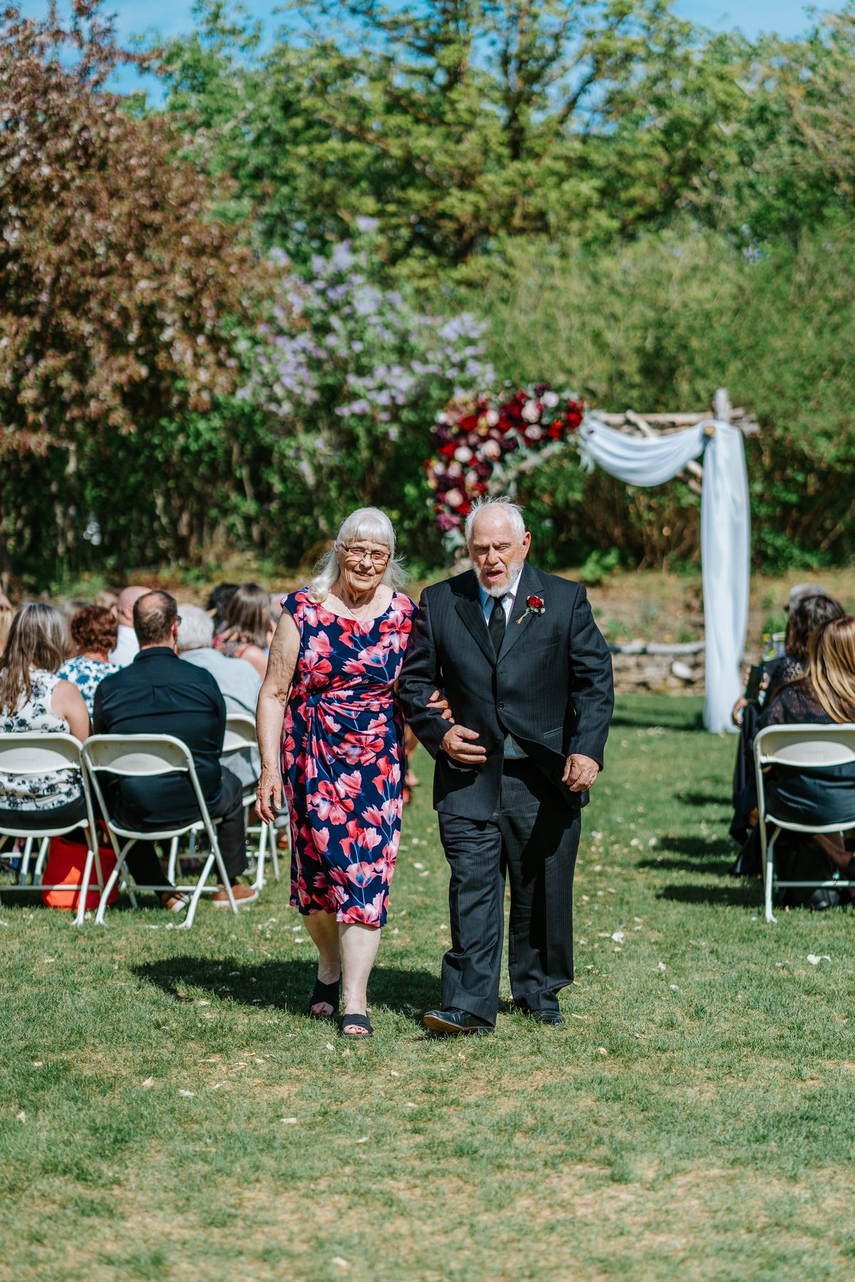 Just-married couple recessional with guests celebrating at Pineridge Hollow, Pine Ridge, Manitoba