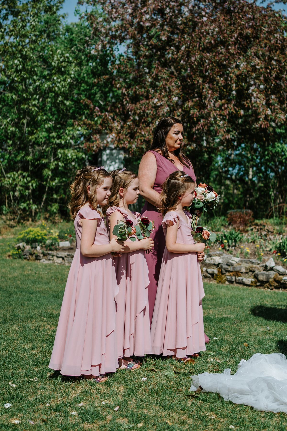 Couple portrait at the floral arbor in the perennial garden ceremony at Pineridge Hollow, Pine Ridge, Manitoba — Ngo Photography