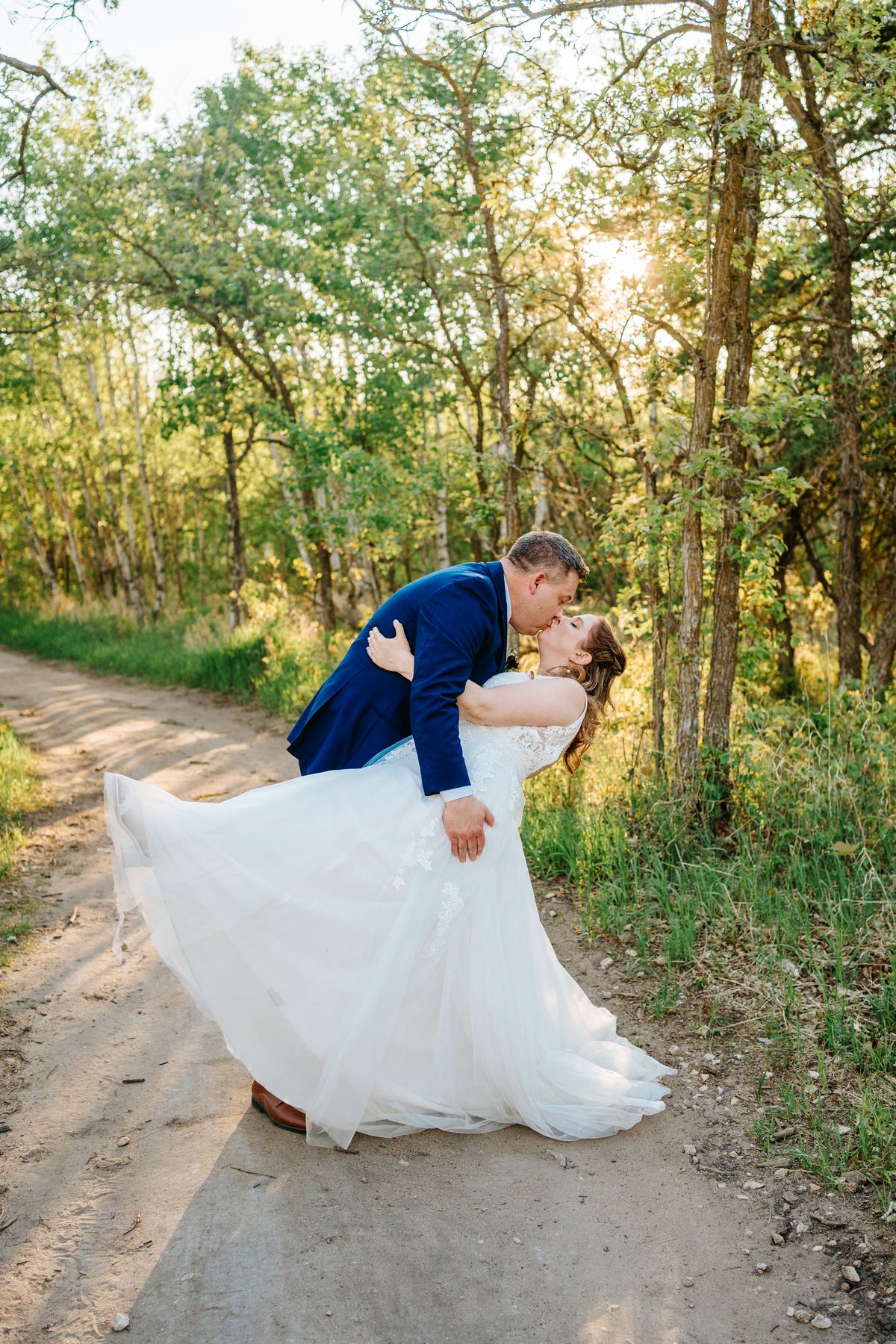 Tara and Carter laughing at the speeches during their Pineridge Hollow reception, Winnipeg wedding photographer