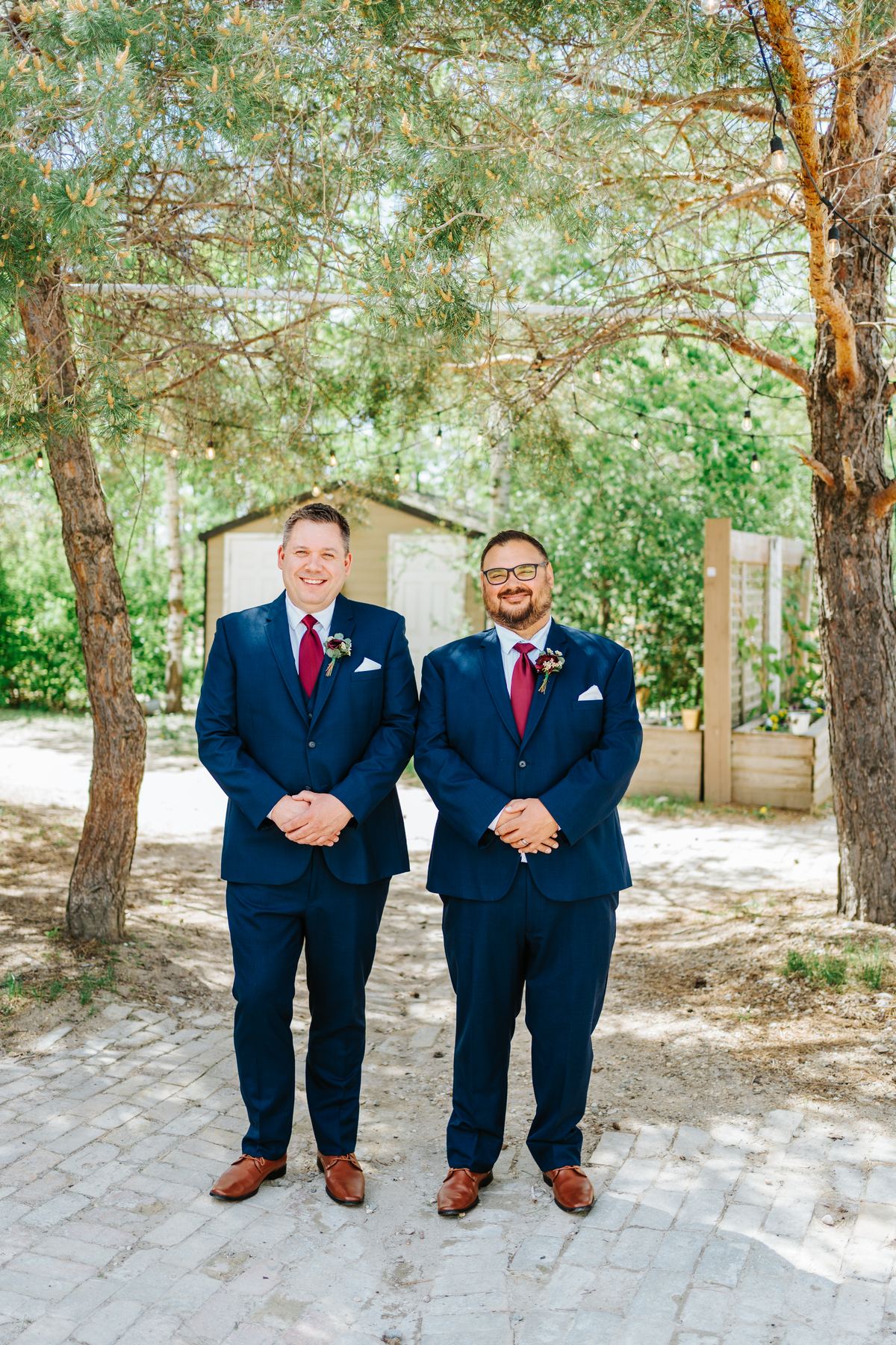 Groom Carter boutonniere detail in navy suit at Pineridge Hollow, Winnipeg wedding photographer