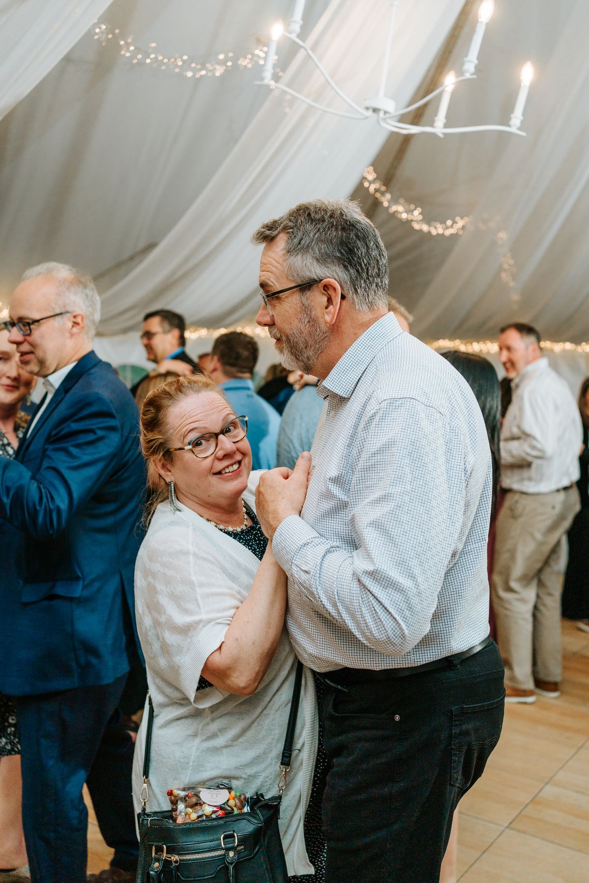 Guests dancing in the canvas pavilion at Pineridge Hollow reception, Pine Ridge, Manitoba — Ngo Photography