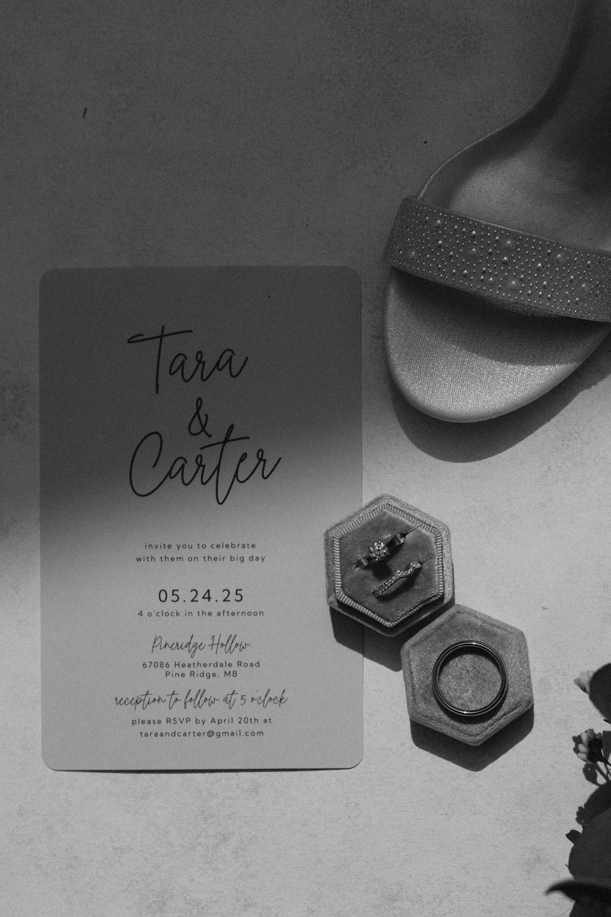 Wedding rings in blue velvet hexagonal boxes on the invitation — Tara and Carter, Pineridge Hollow, Manitoba