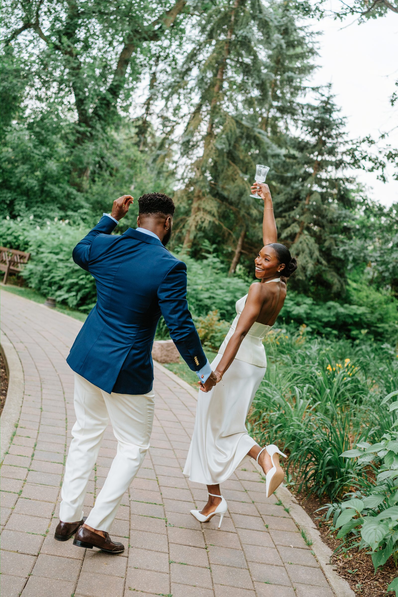 Tobi and Emeka at the marriage licence signing — candid documentary wedding photography, Leo Mol Sculpture Garden, Assiniboine Park, Winnipeg
