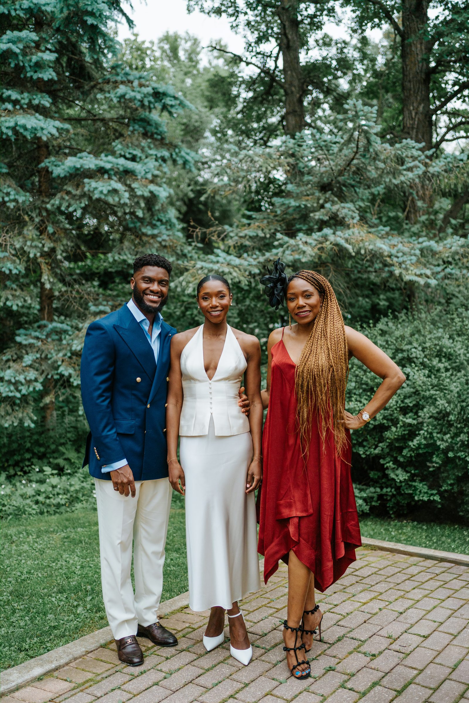 Tobi and Emeka approaching the ceremony area at Leo Mol Sculpture Garden in Assiniboine Park — Winnipeg micro-wedding photography by Ngo Photography