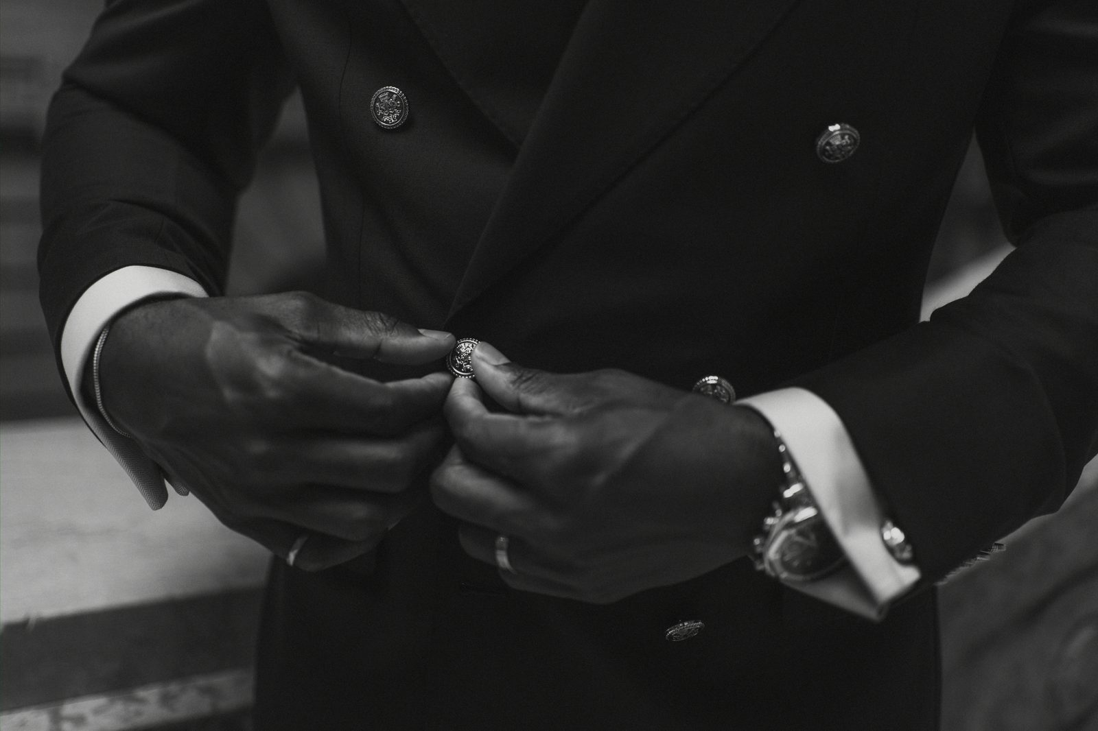 Detail of Tobi's bouquet and white satin skirt at the Manitoba Legislative Building — Winnipeg wedding photography by Chris Ngo