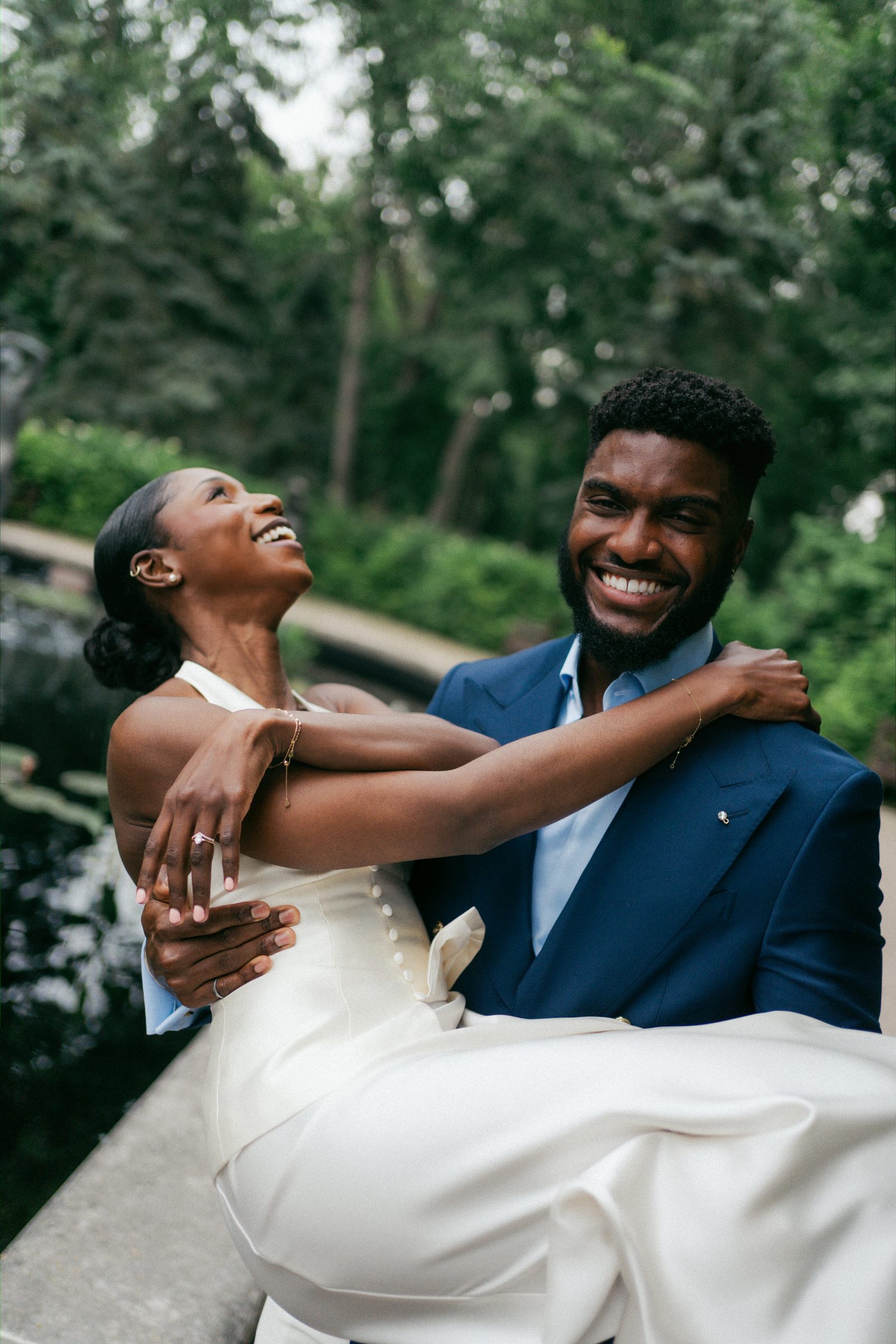 Film-style couple portrait at Leo Mol Sculpture Garden in Assiniboine Park — Tobi and Emeka, Winnipeg wedding photography by Ngo Photography