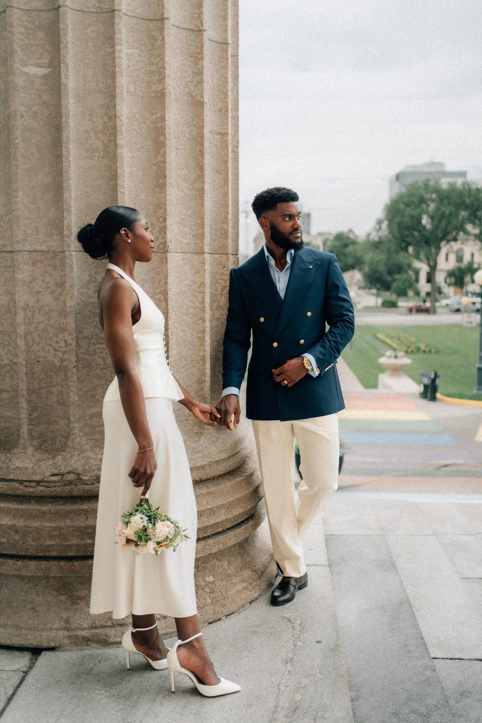 Film-style portrait of Tobi and Emeka at Leo Mol Sculpture Garden — Assiniboine Park, Winnipeg wedding photography