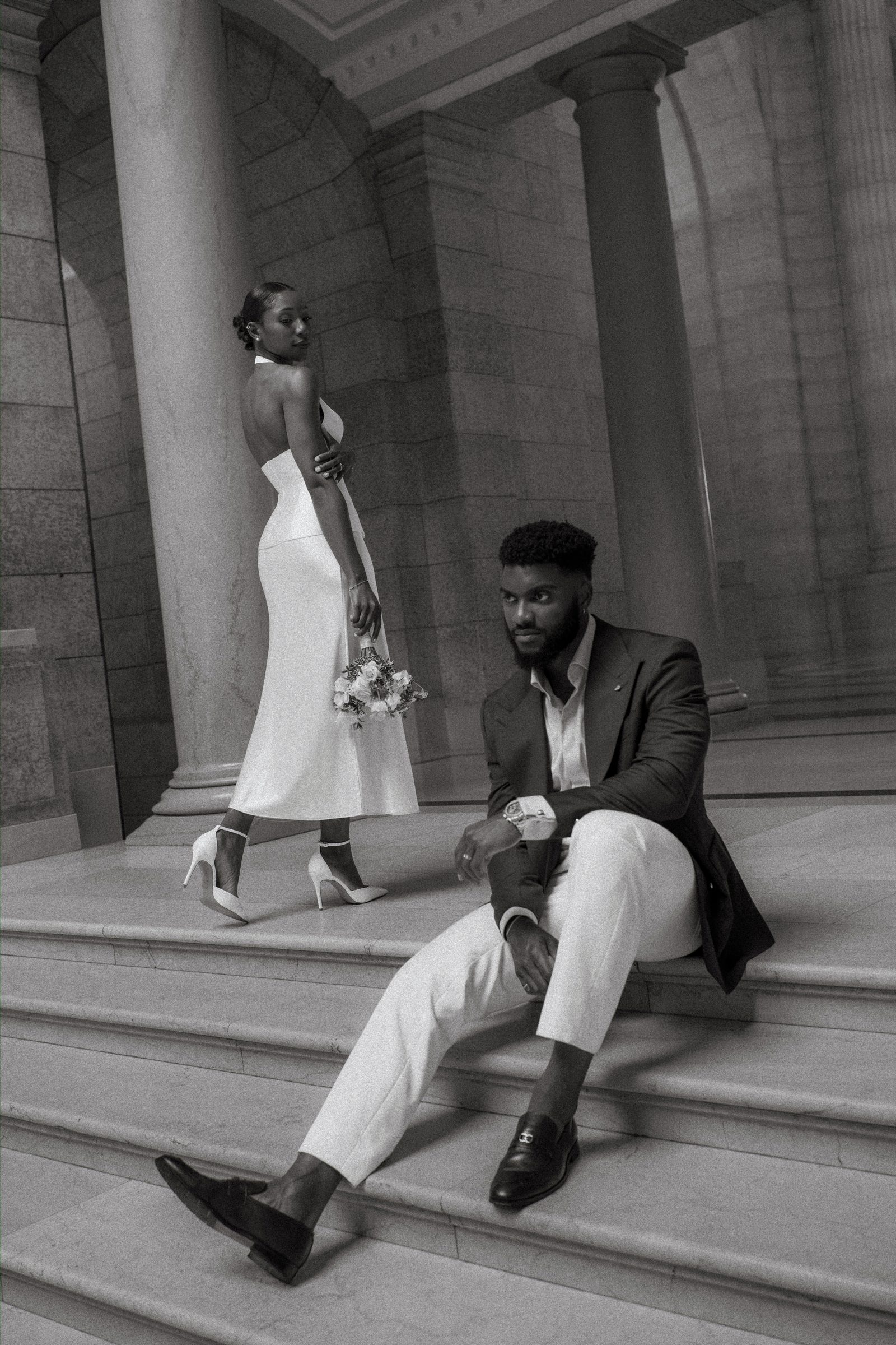 Tobi and Emeka together at the Manitoba Legislative Building — couple portrait on the exterior steps, Winnipeg wedding photography by Ngo Photography