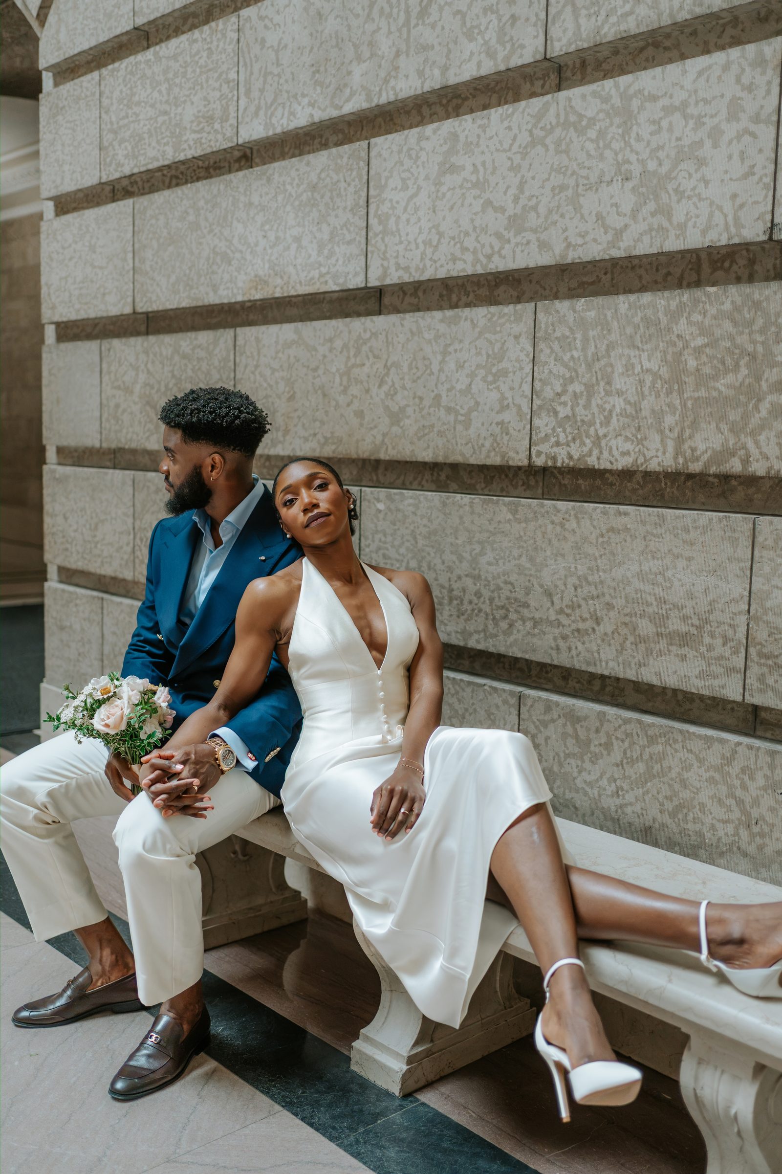 Tobi and Emeka together in the Legislative Building colonnade — couple portrait, Winnipeg wedding photography